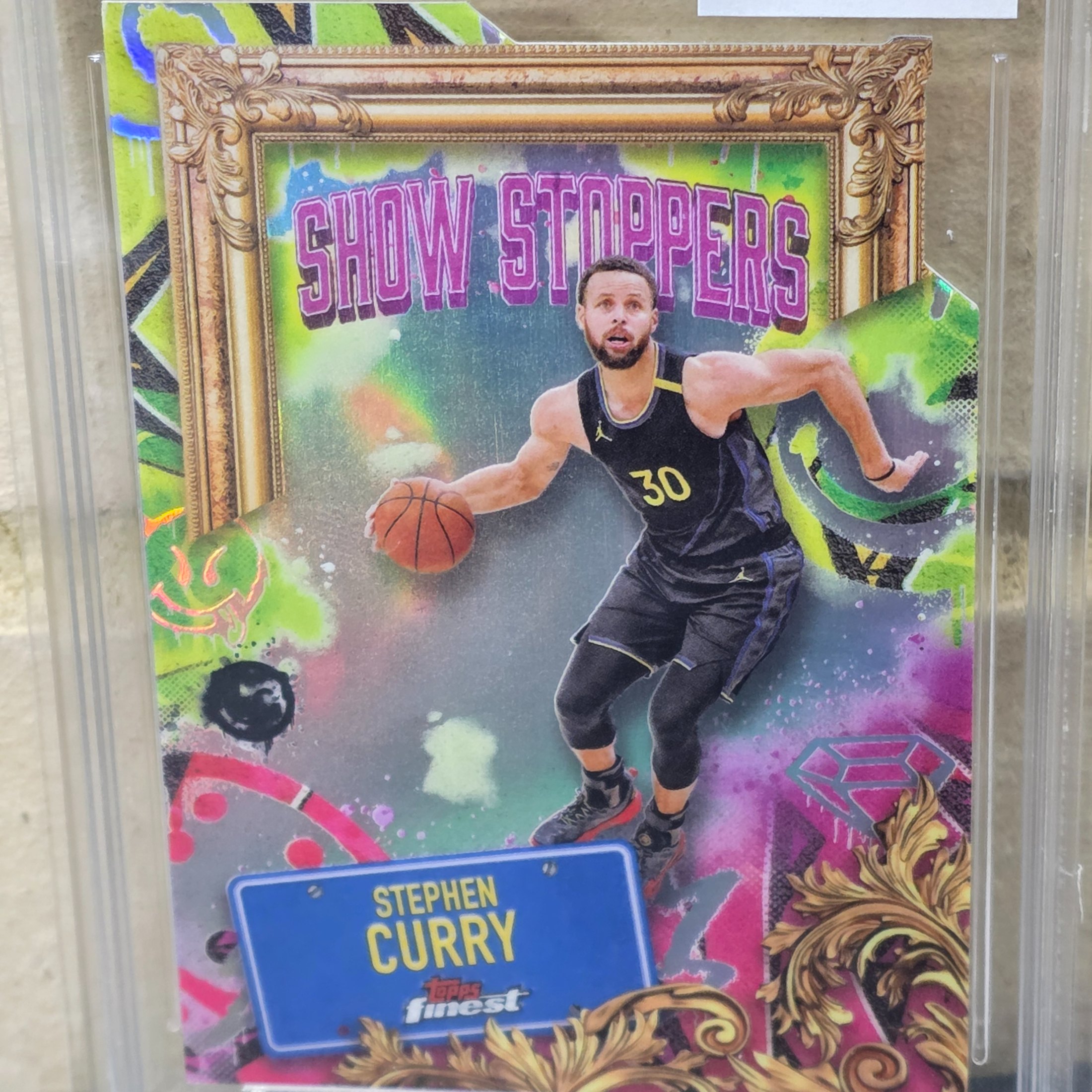A professionally graded 2025 Topps Finest NBA Stephen Curry 'Show Stoppers' trading card, graded 8.5 NM-MT+ by TCG Grading.