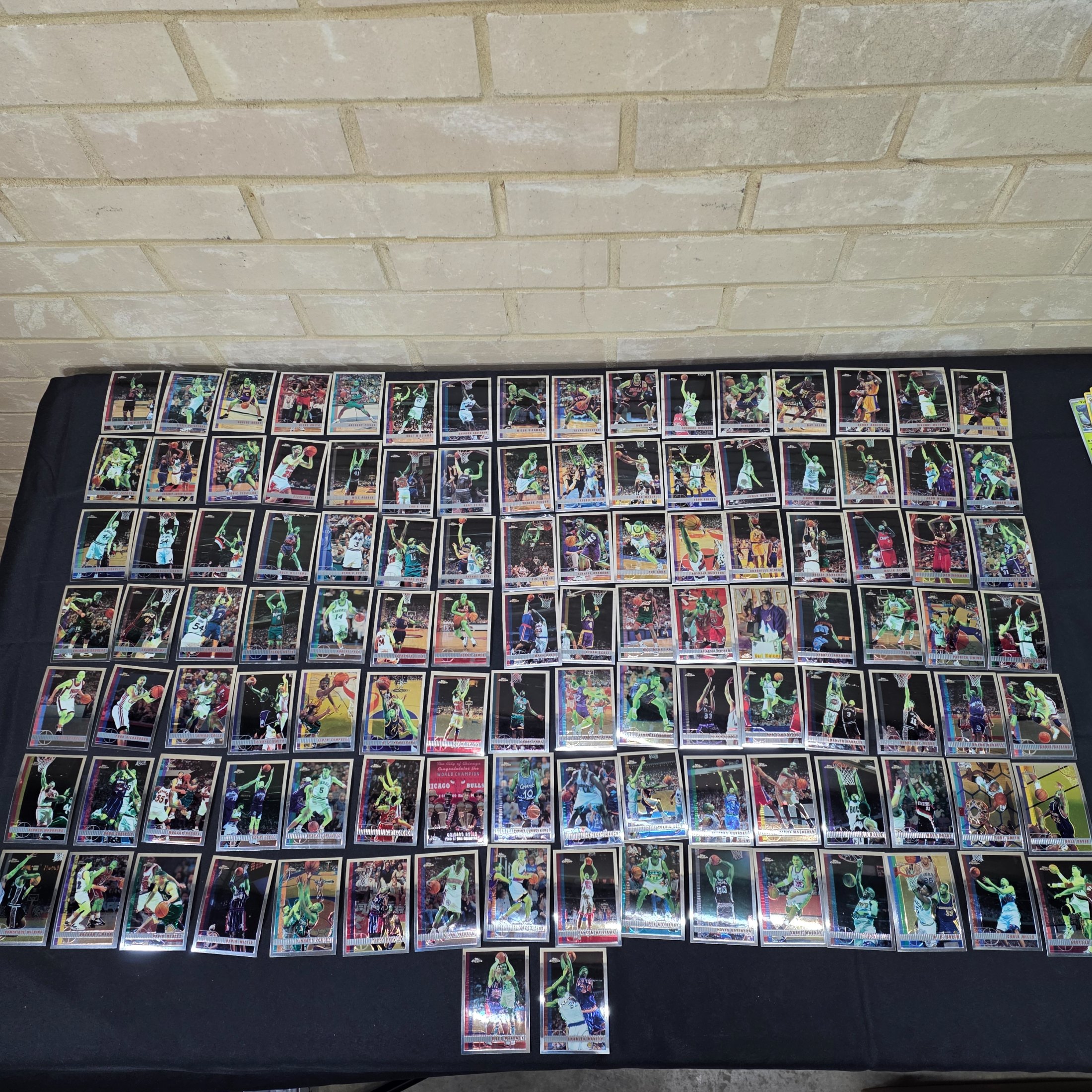 An extensive collection of 1996-97 Topps Chrome NBA basketball collectable cards, featuring a wide array of prominent players from the era in their distinctive chrome finish.