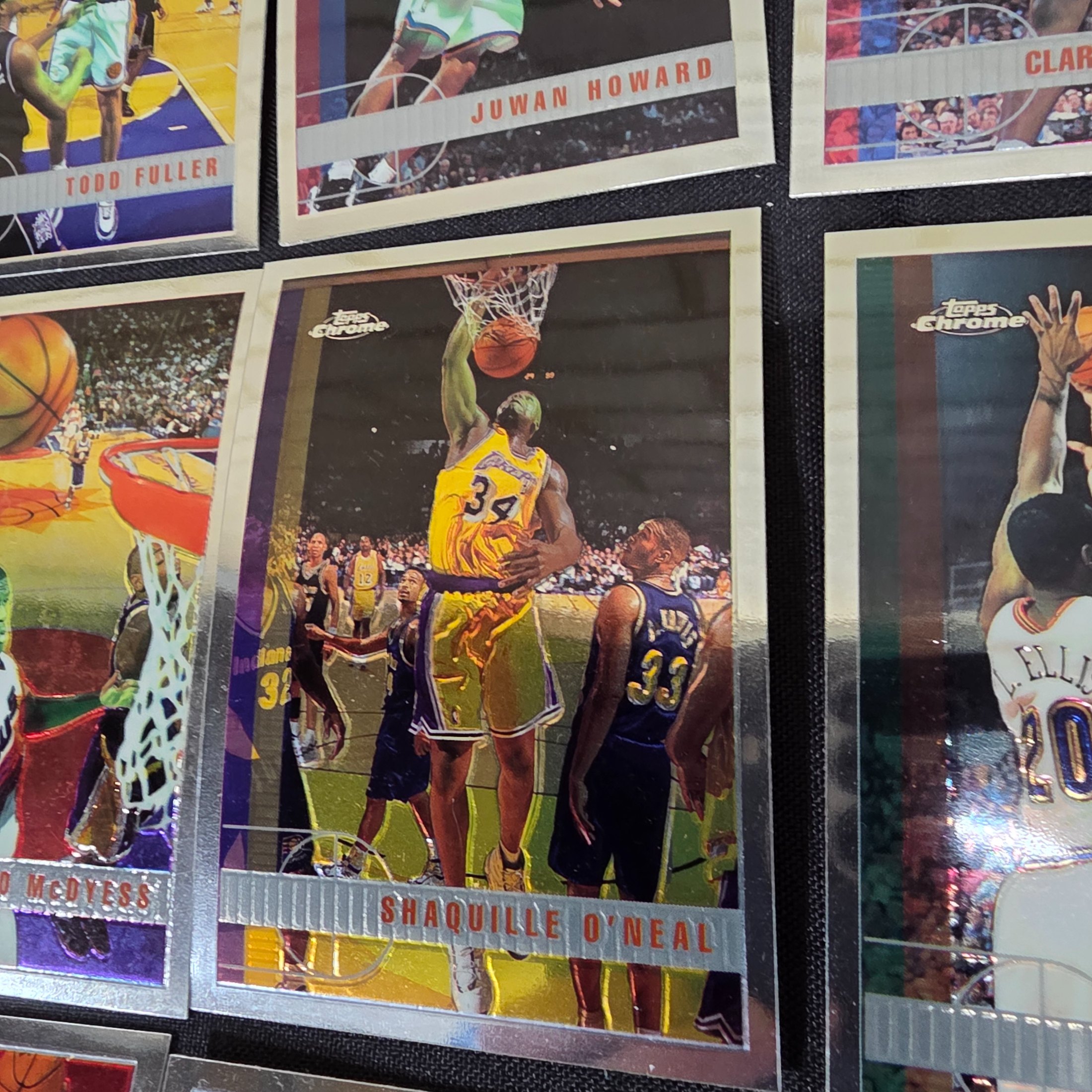 An extensive collection of 1996-97 Topps Chrome NBA basketball collectable cards, featuring a wide array of prominent players from the era in their distinctive chrome finish. - View 3