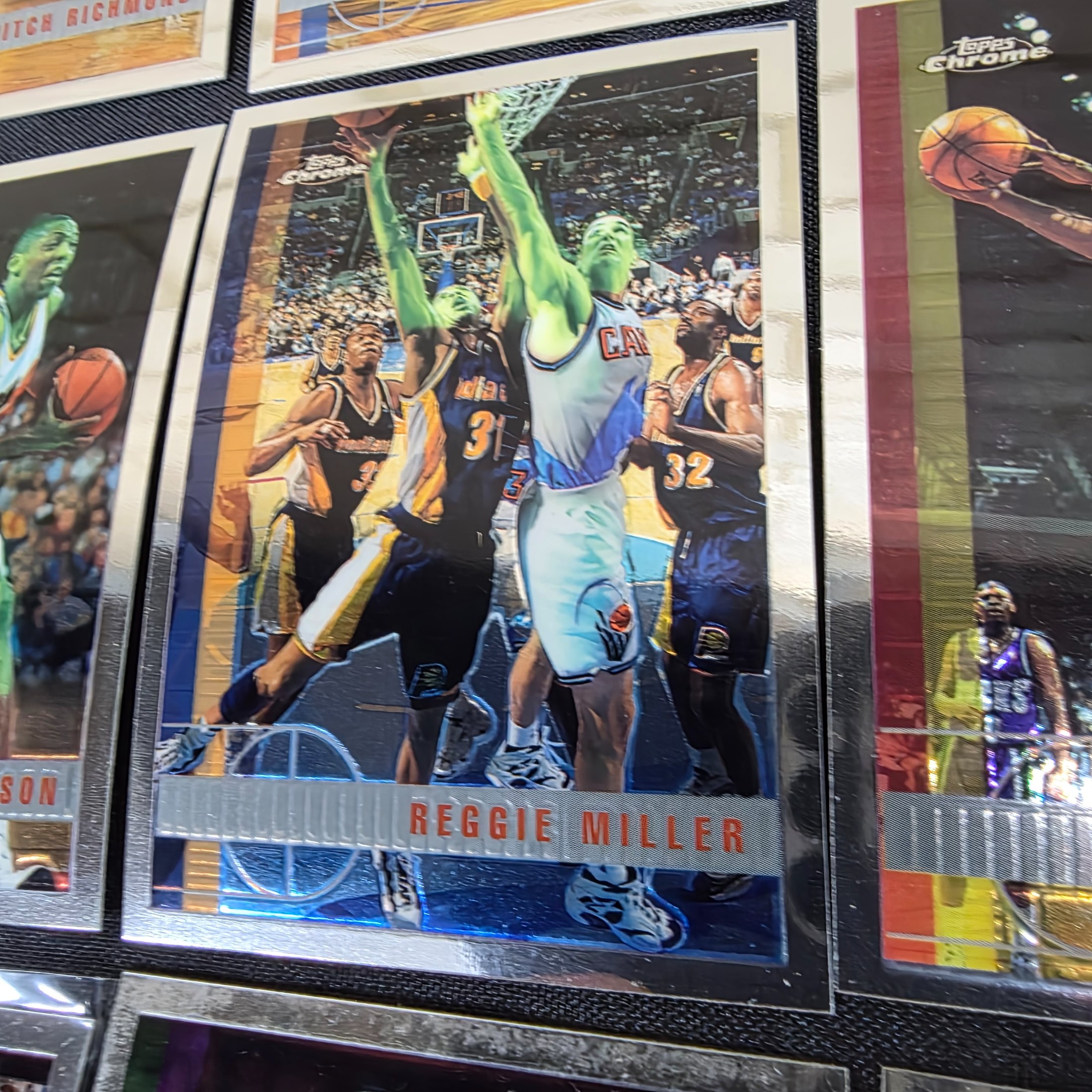 An extensive collection of 1996-97 Topps Chrome NBA basketball collectable cards, featuring a wide array of prominent players from the era in their distinctive chrome finish. - View 4