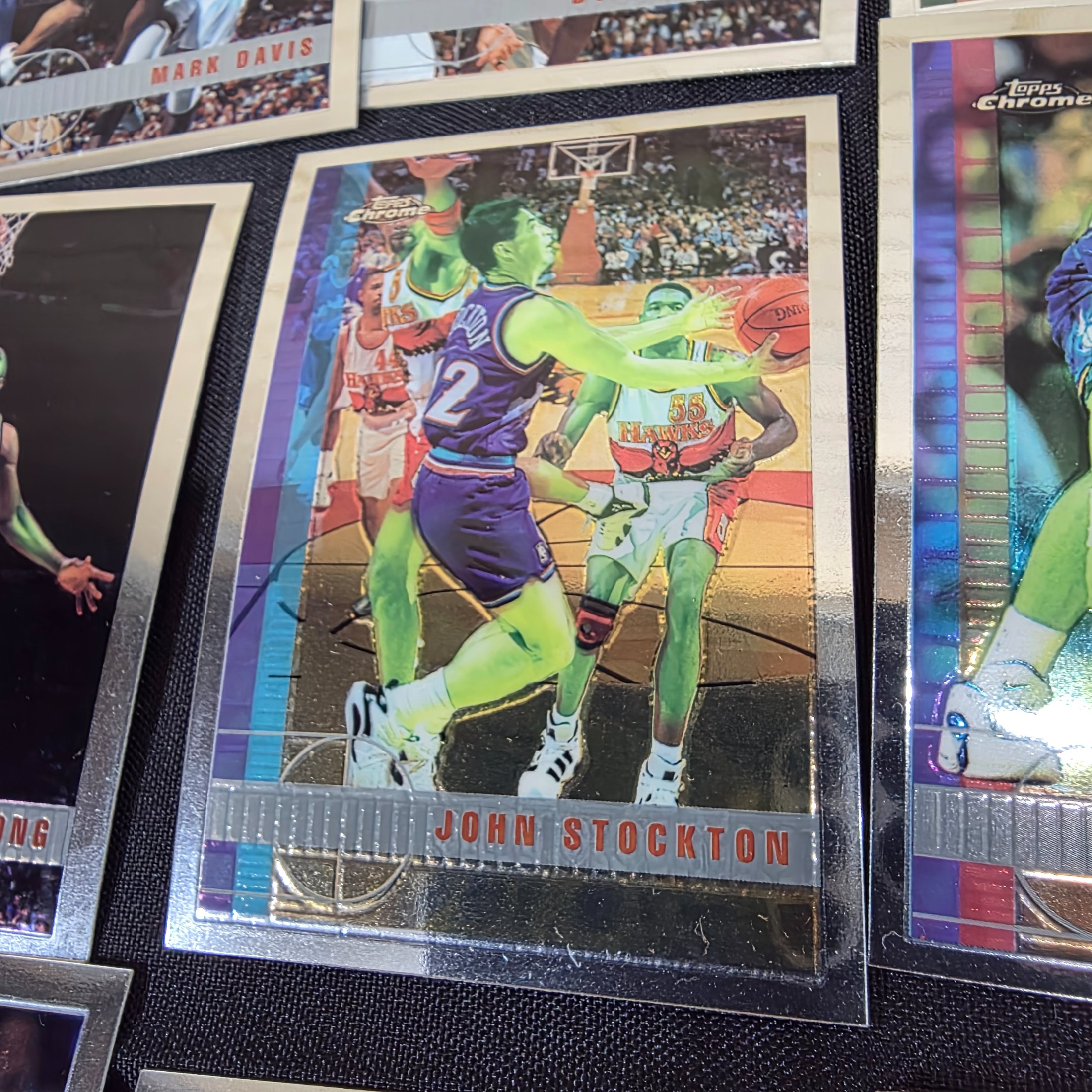 An extensive collection of 1996-97 Topps Chrome NBA basketball collectable cards, featuring a wide array of prominent players from the era in their distinctive chrome finish. - View 5