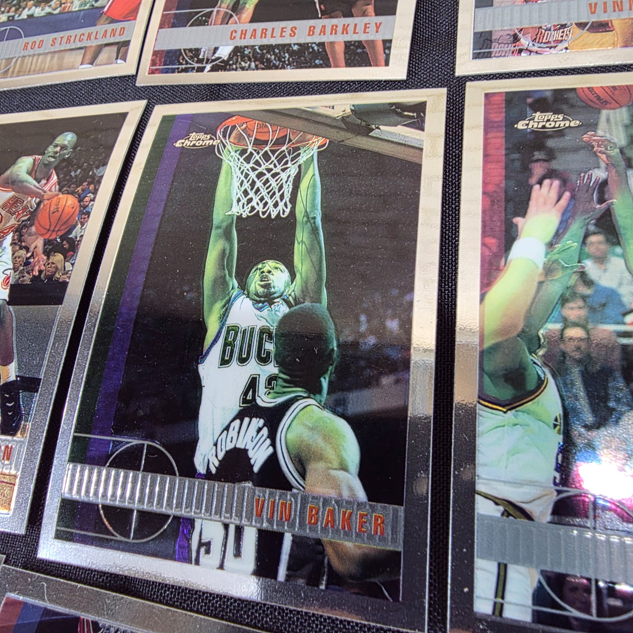 An extensive collection of 1996-97 Topps Chrome NBA basketball collectable cards, featuring a wide array of prominent players from the era in their distinctive chrome finish. - View 6