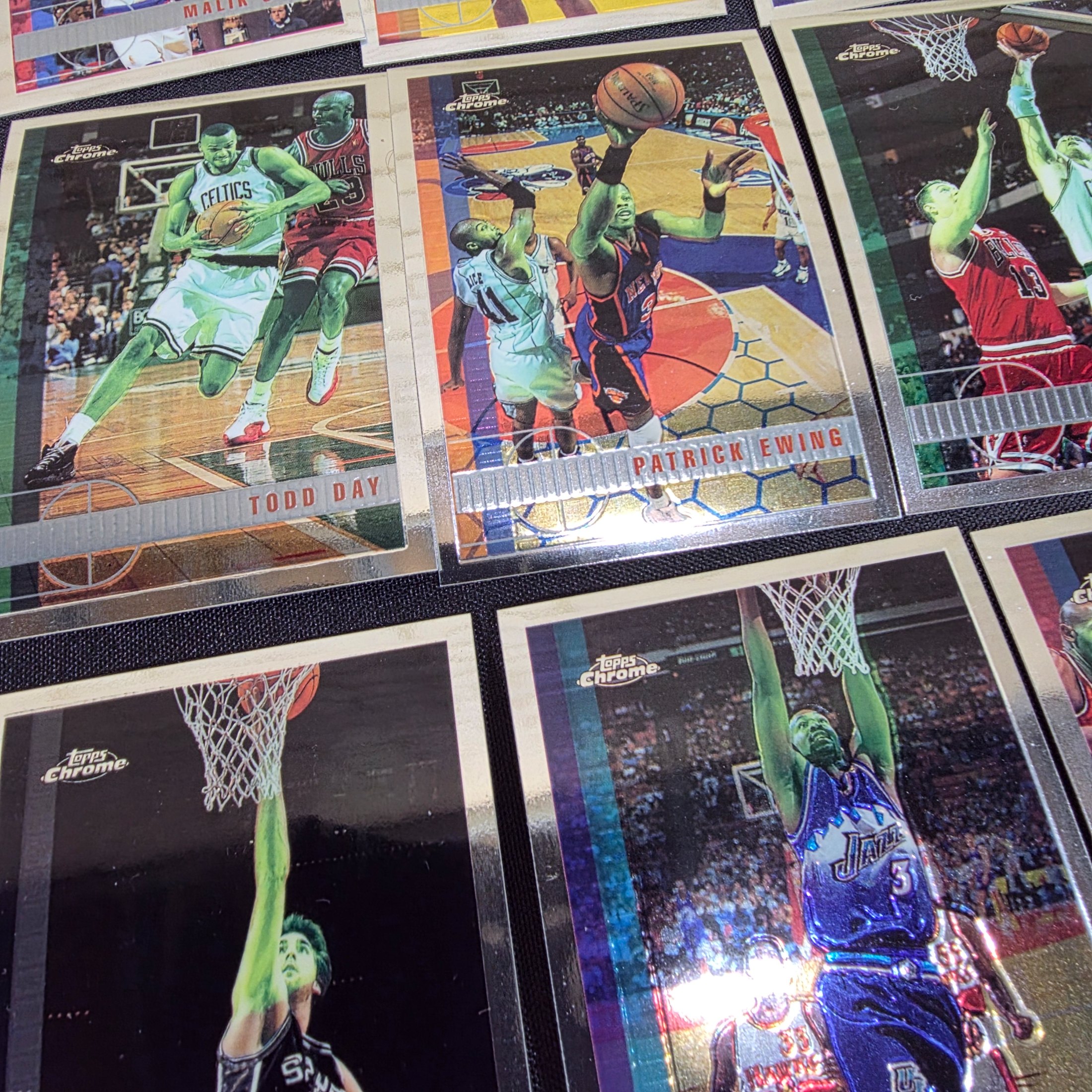 An extensive collection of 1996-97 Topps Chrome NBA basketball collectable cards, featuring a wide array of prominent players from the era in their distinctive chrome finish. - View 7