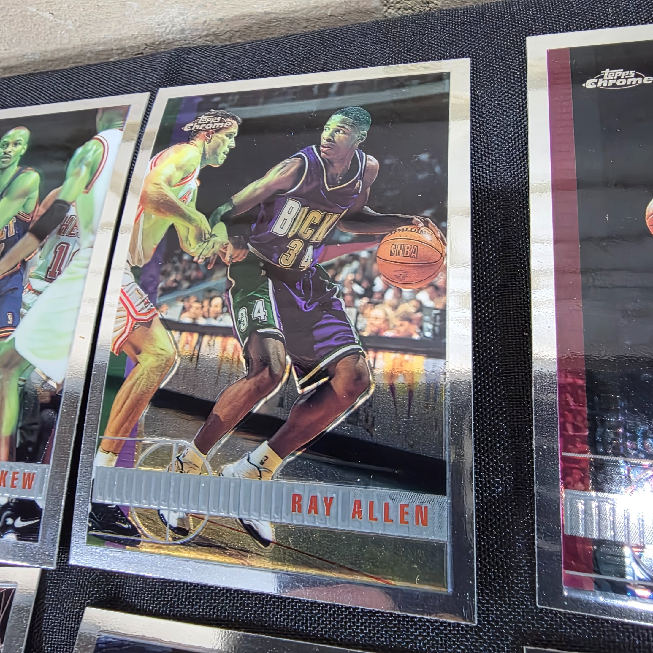 An extensive collection of 1996-97 Topps Chrome NBA basketball collectable cards, featuring a wide array of prominent players from the era in their distinctive chrome finish. - View 8