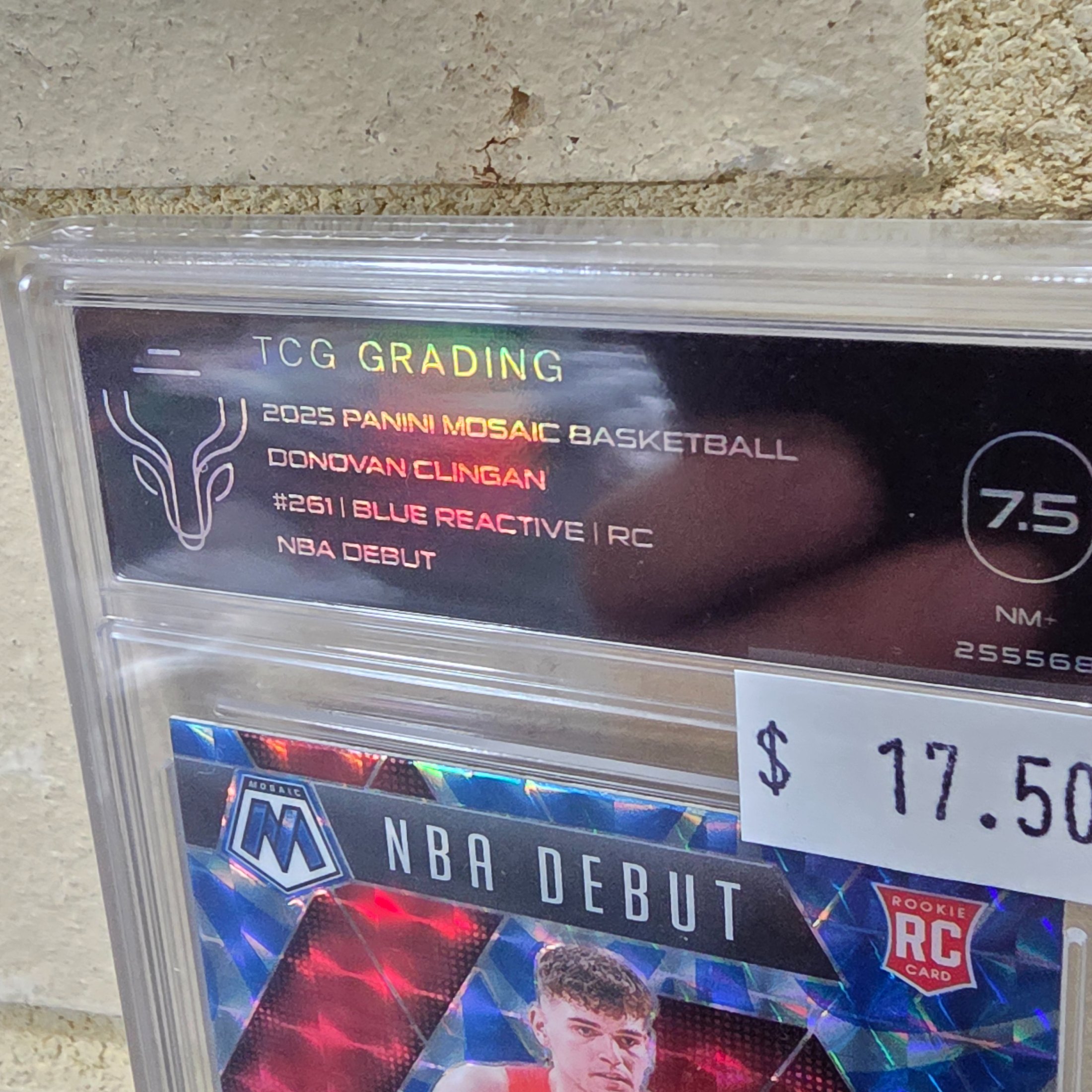A professionally graded 2025 Panini Mosaic Basketball rookie card featuring Donovan Clingan, encased in a TCG Grading slab with a grade of 7.5 (NM+). - View 2
