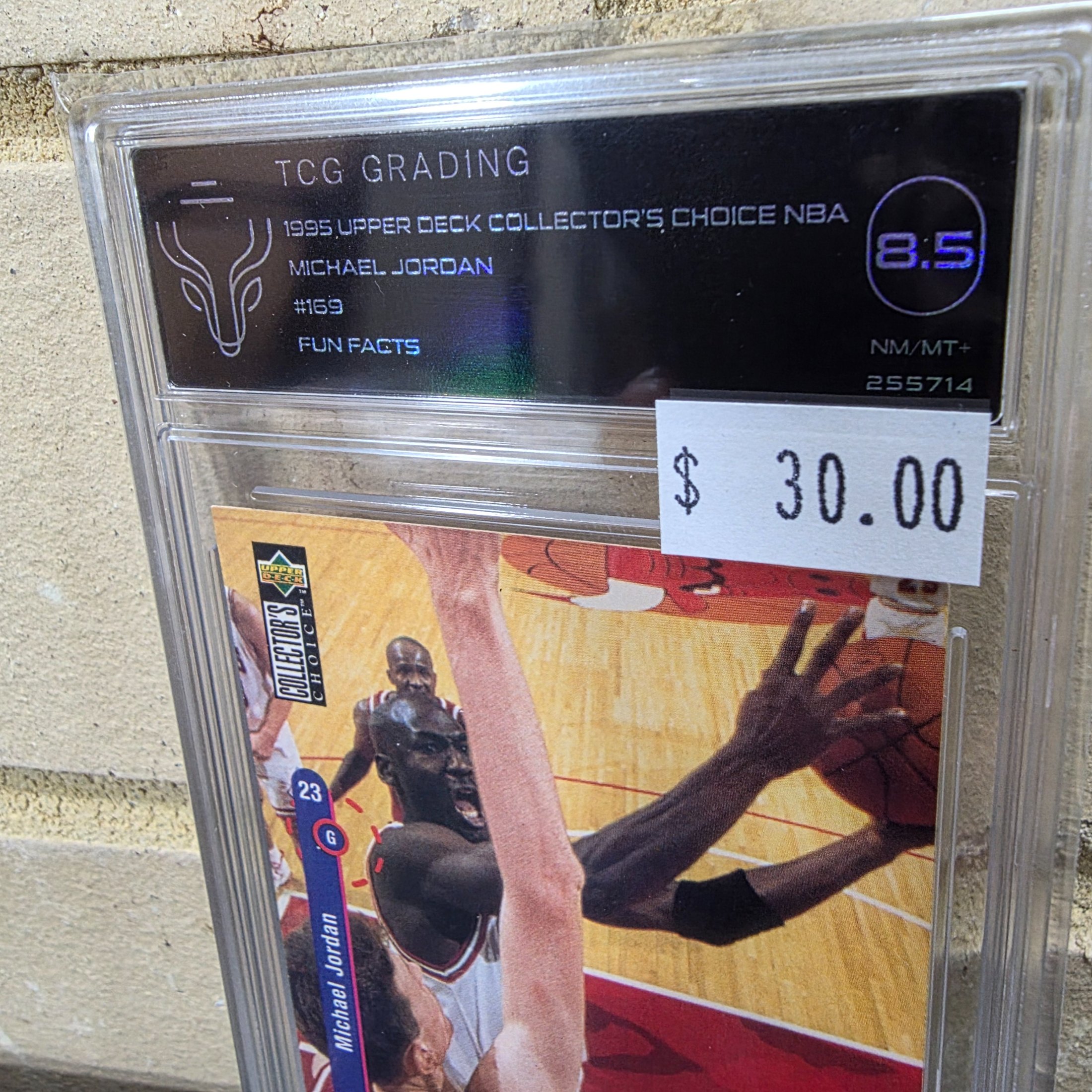 A professionally graded 1995 Upper Deck Collector's Choice NBA Michael Jordan #169 'Fun Facts' basketball card, encapsulated by TCG Grading with an 8.5 NM/MT+ grade. - View 2