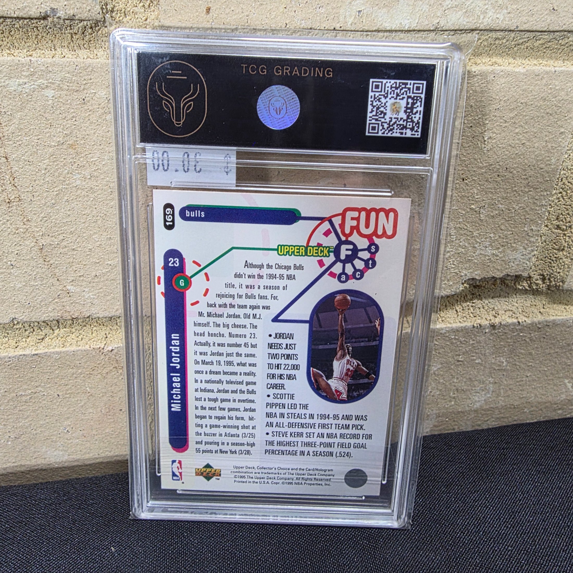 A professionally graded 1995 Upper Deck Collector's Choice NBA Michael Jordan #169 'Fun Facts' basketball card, encapsulated by TCG Grading with an 8.5 NM/MT+ grade. - View 3