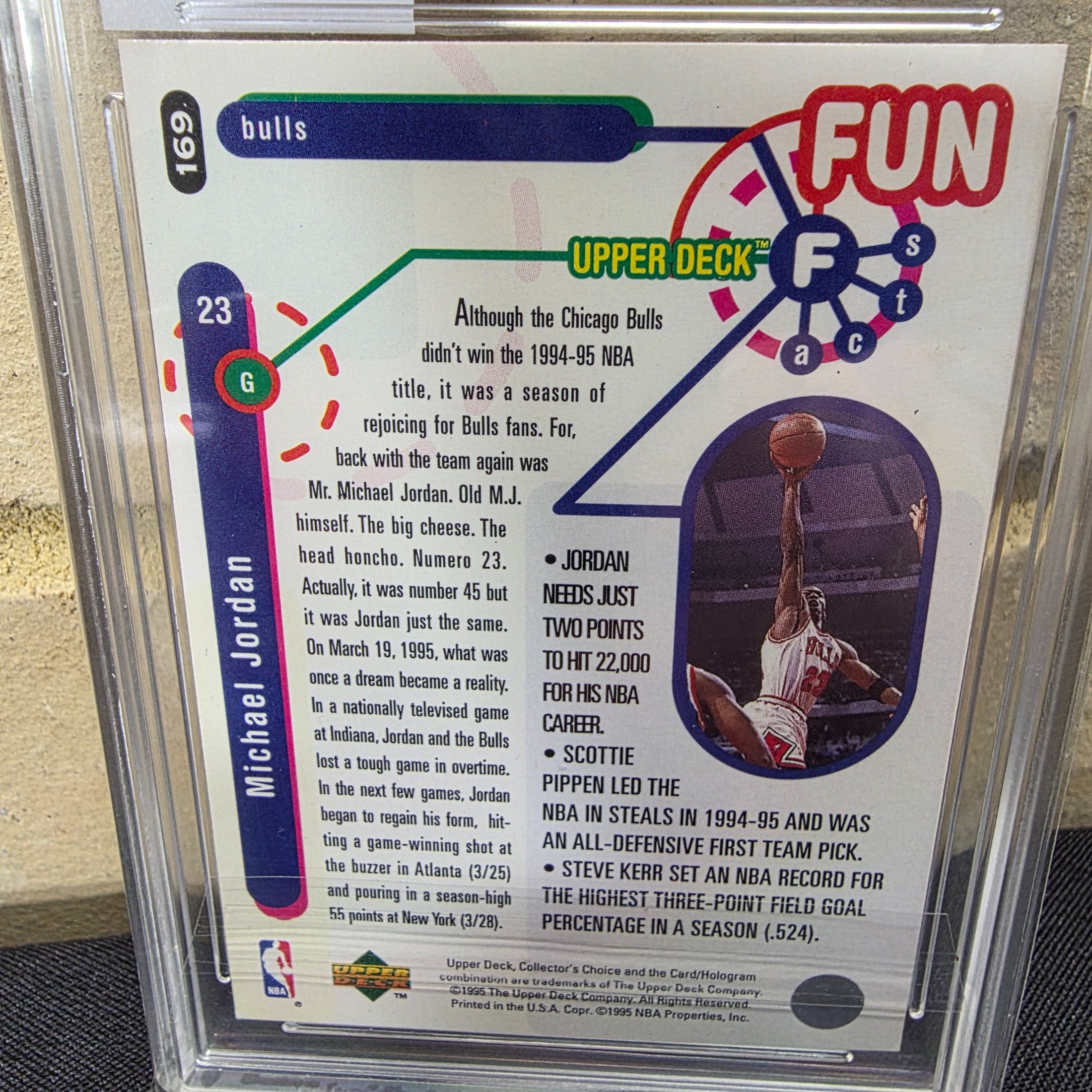 A professionally graded 1995 Upper Deck Collector's Choice NBA Michael Jordan #169 'Fun Facts' basketball card, encapsulated by TCG Grading with an 8.5 NM/MT+ grade. - View 4