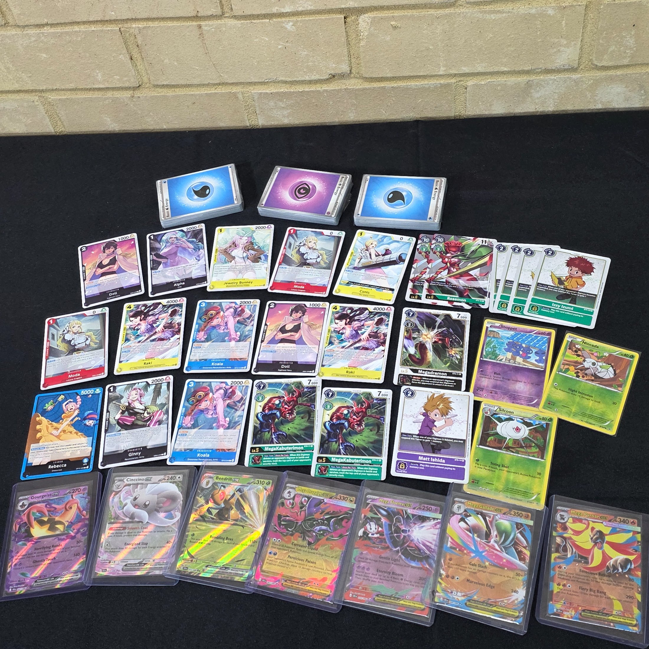 A comprehensive collection of trading card game cards, featuring popular titles such as Pokémon, Digimon, and One Piece, suitable for collectors and players.