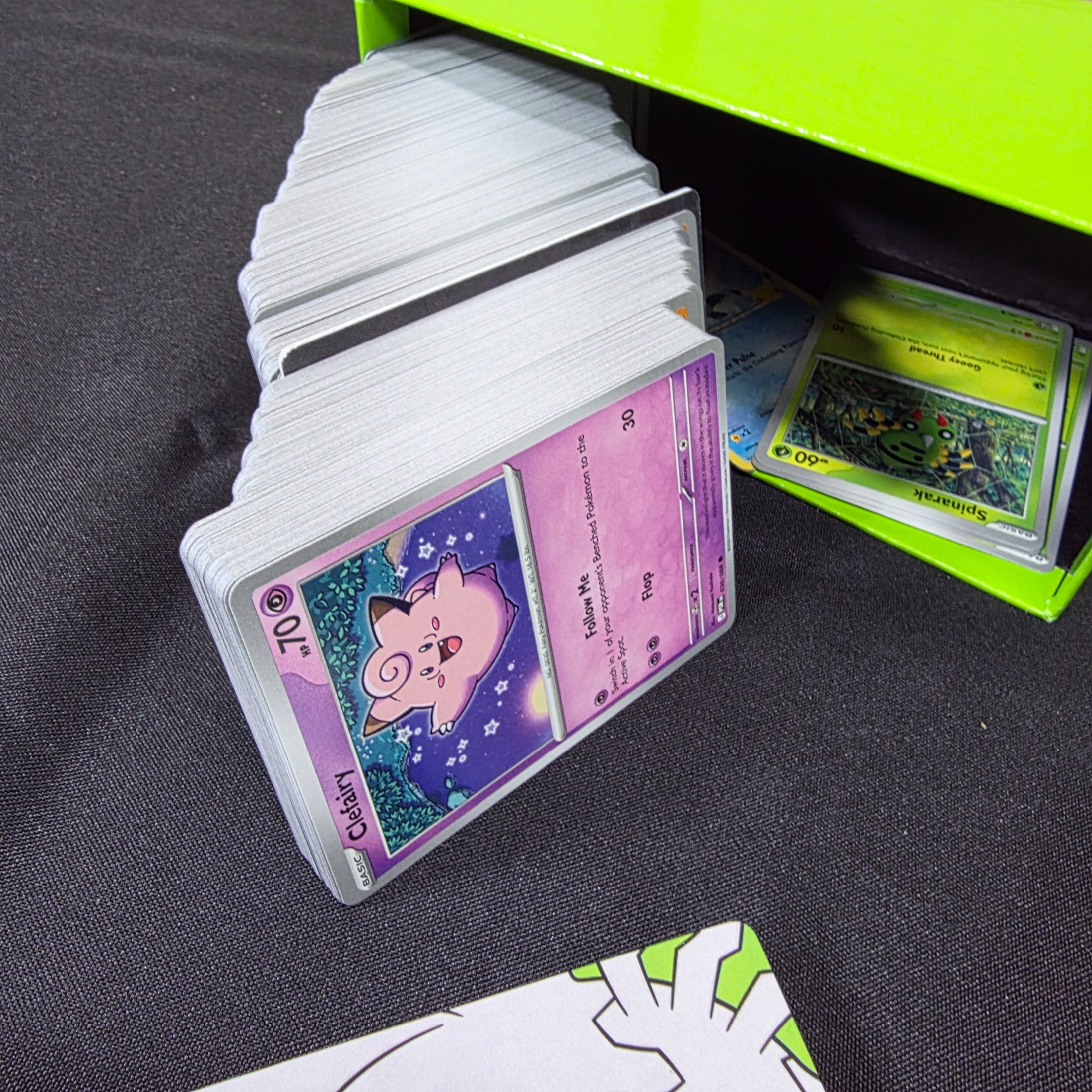 A green and black Pokémon Trading Card Game 'Perfect Order' storage box filled with assorted bulk cards. - View 8