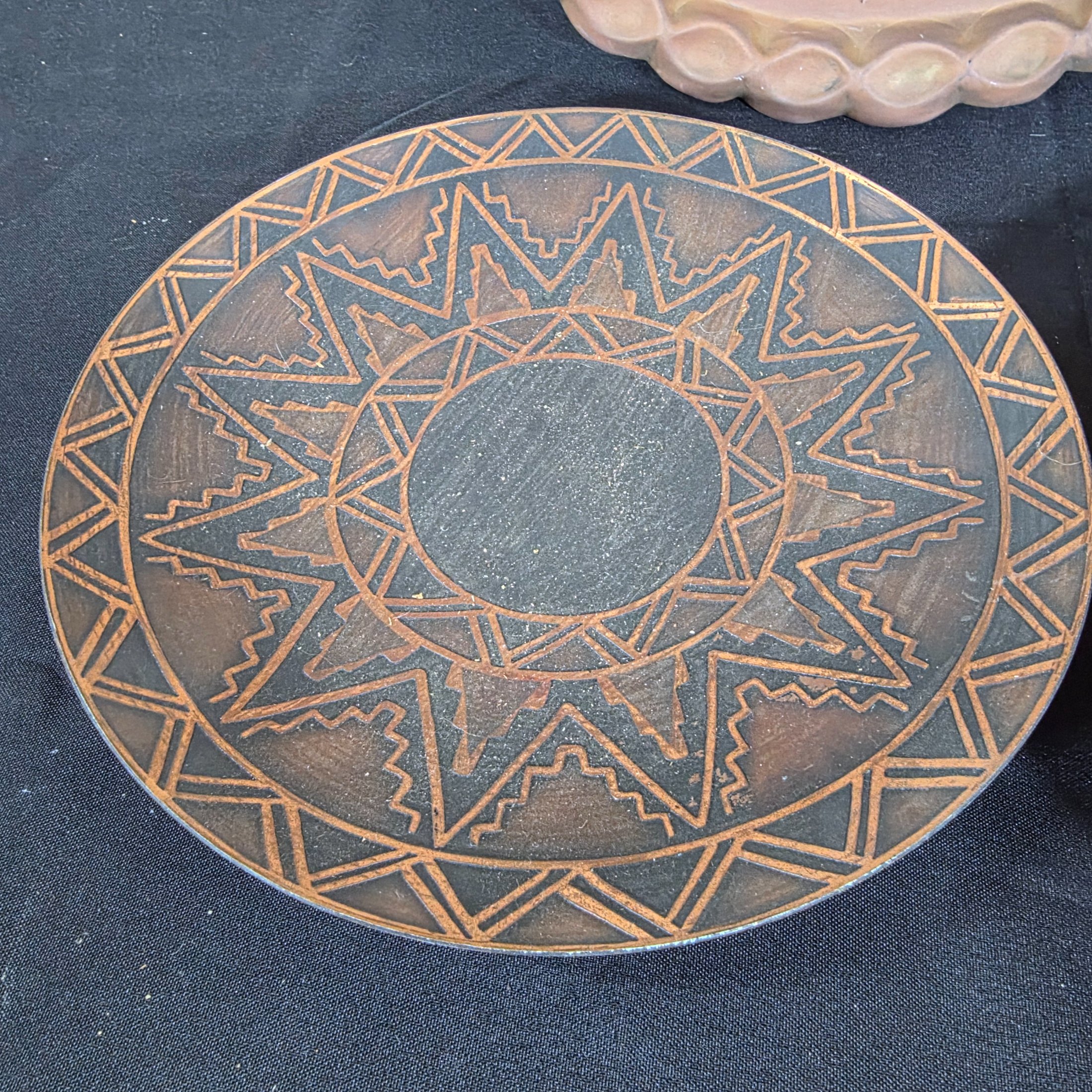 A collection of four assorted decorative metal plates and trays, featuring various embossed and etched designs, suitable for vintage decor. - View 2