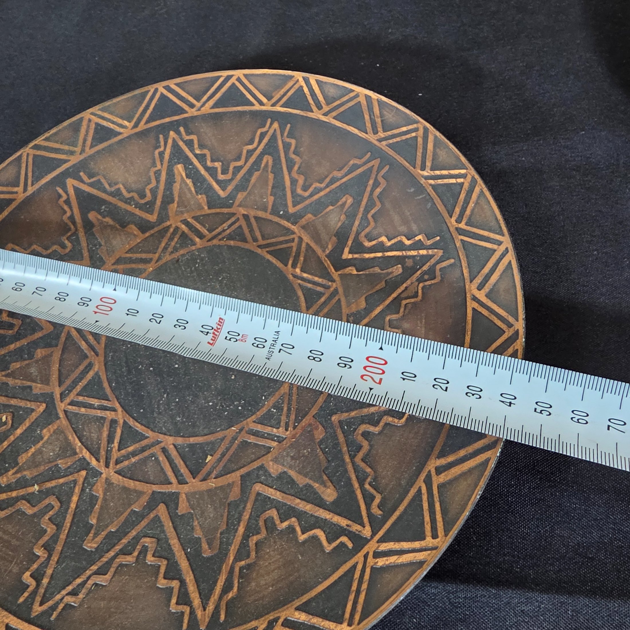 A collection of four assorted decorative metal plates and trays, featuring various embossed and etched designs, suitable for vintage decor. - View 4