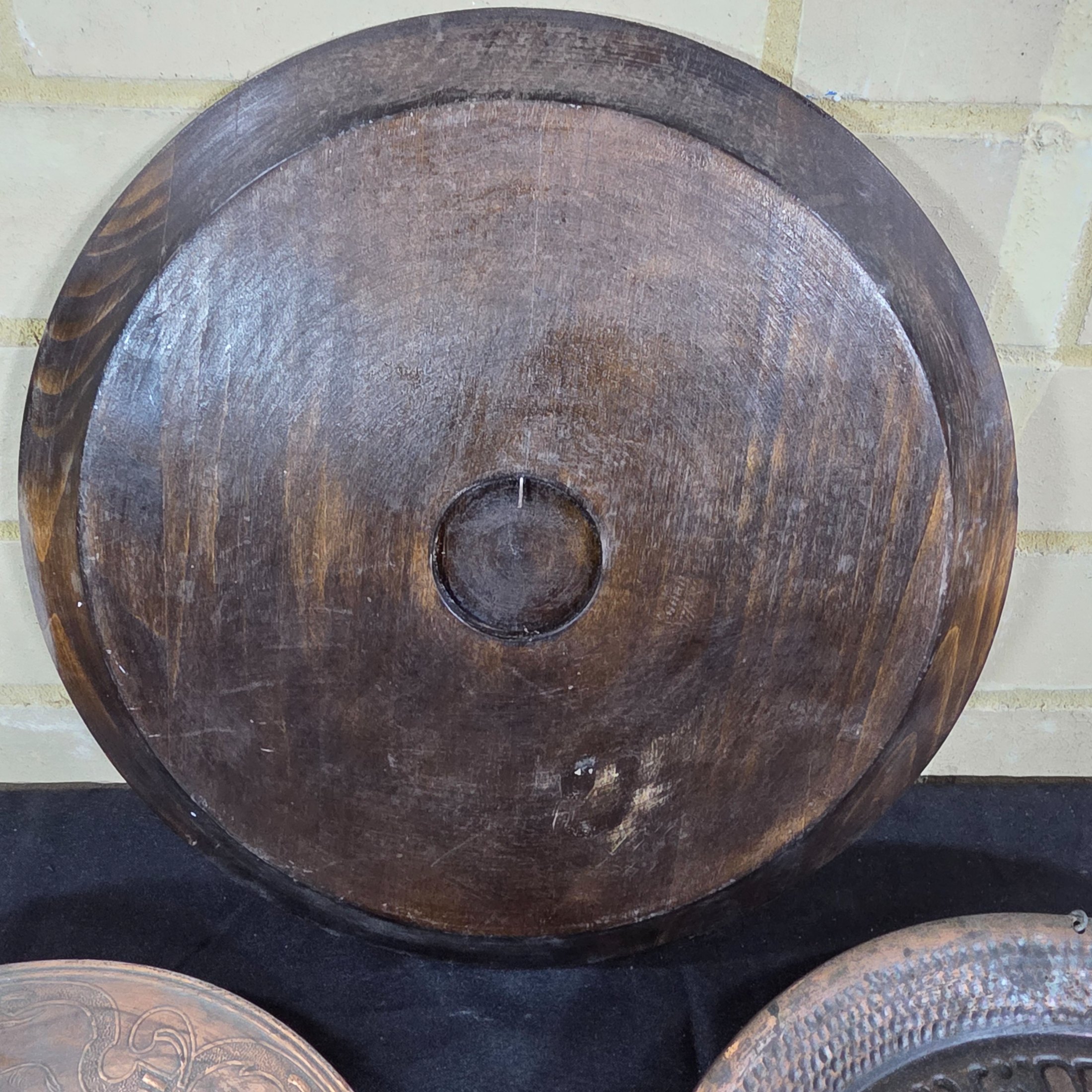 A collection of three vintage decorative wall plates, including a wooden plate with a Polish eagle crest and two copper or bronze plates featuring classical hunting and musical figures. - View 5
