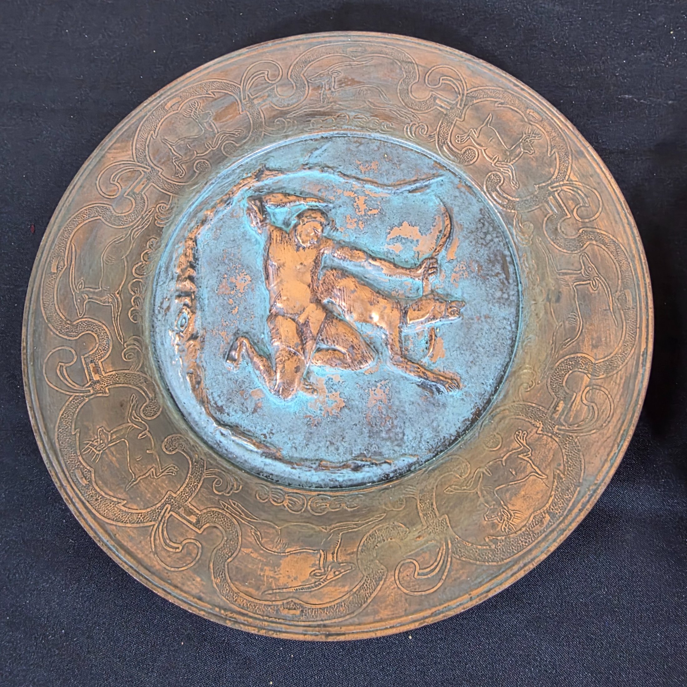 A collection of three vintage decorative wall plates, including a wooden plate with a Polish eagle crest and two copper or bronze plates featuring classical hunting and musical figures. - View 7