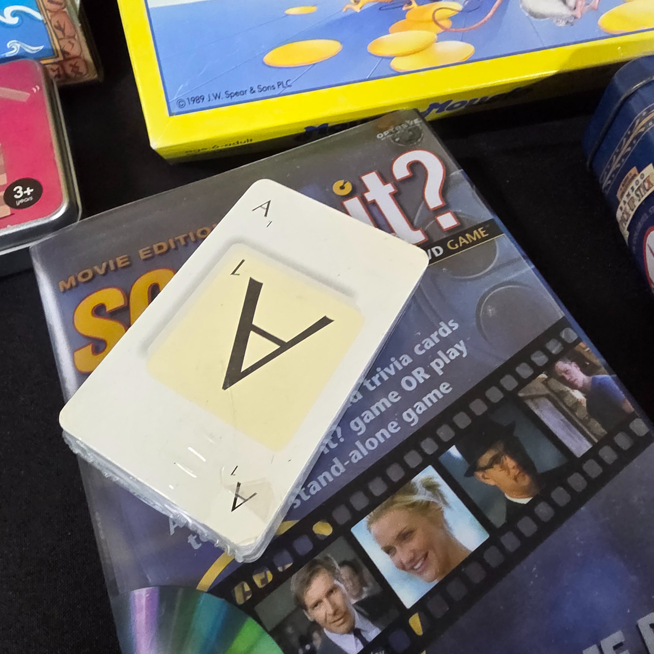 A diverse collection of modern and vintage board games, card games, and puzzles, including Monopoly, Jenga Quake, Mousie Mousie, and a Captain Cook's Voyage puzzle. - View 5