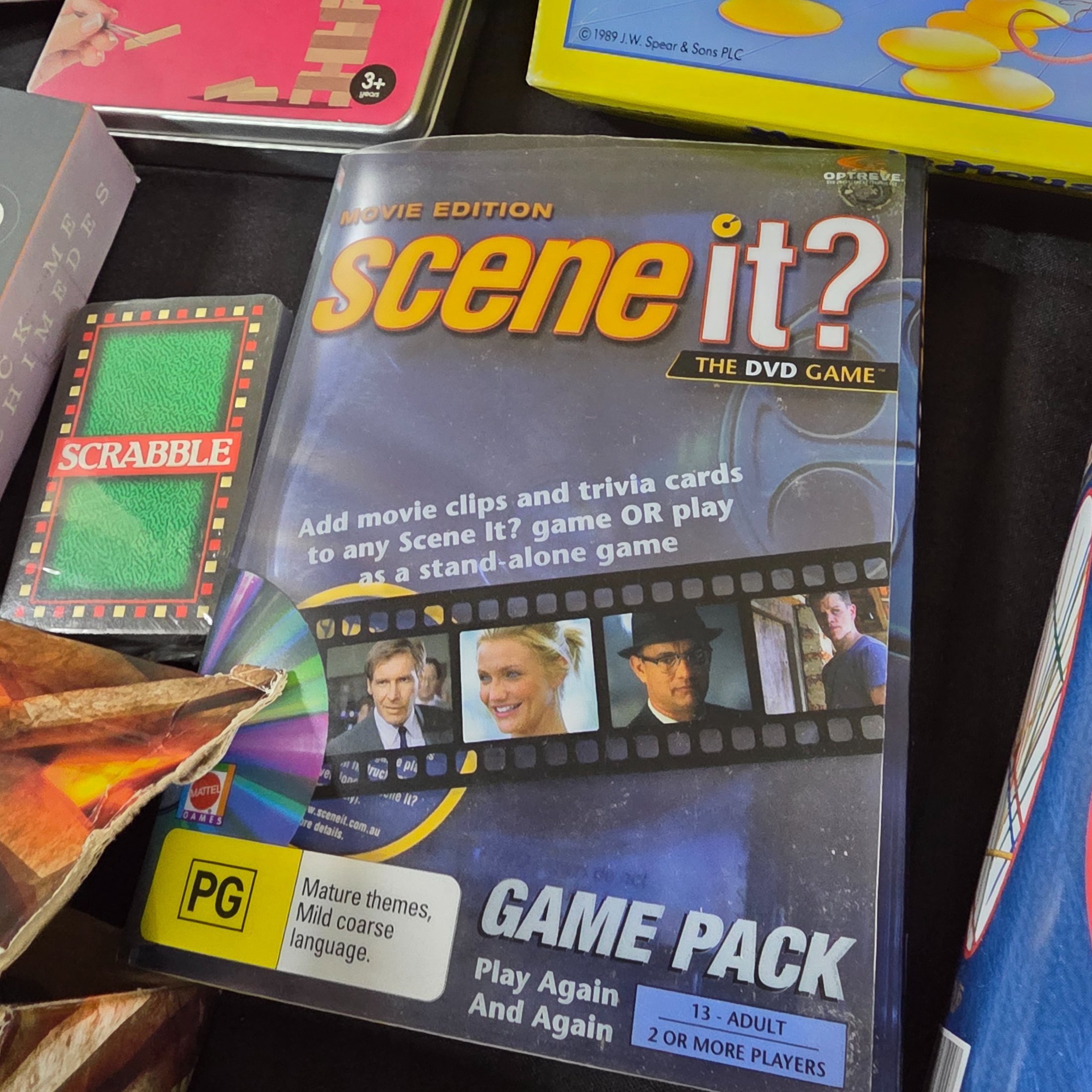 A diverse collection of modern and vintage board games, card games, and puzzles, including Monopoly, Jenga Quake, Mousie Mousie, and a Captain Cook's Voyage puzzle. - View 6