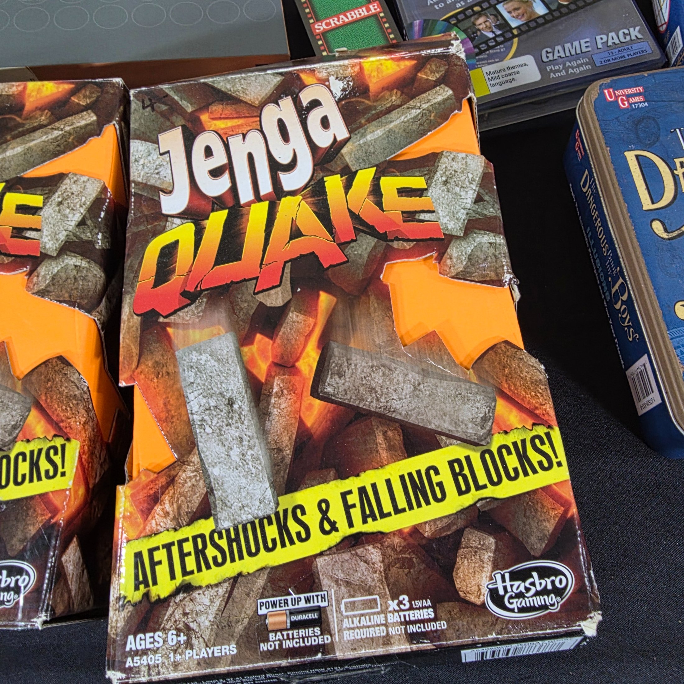 A diverse collection of modern and vintage board games, card games, and puzzles, including Monopoly, Jenga Quake, Mousie Mousie, and a Captain Cook's Voyage puzzle. - View 7