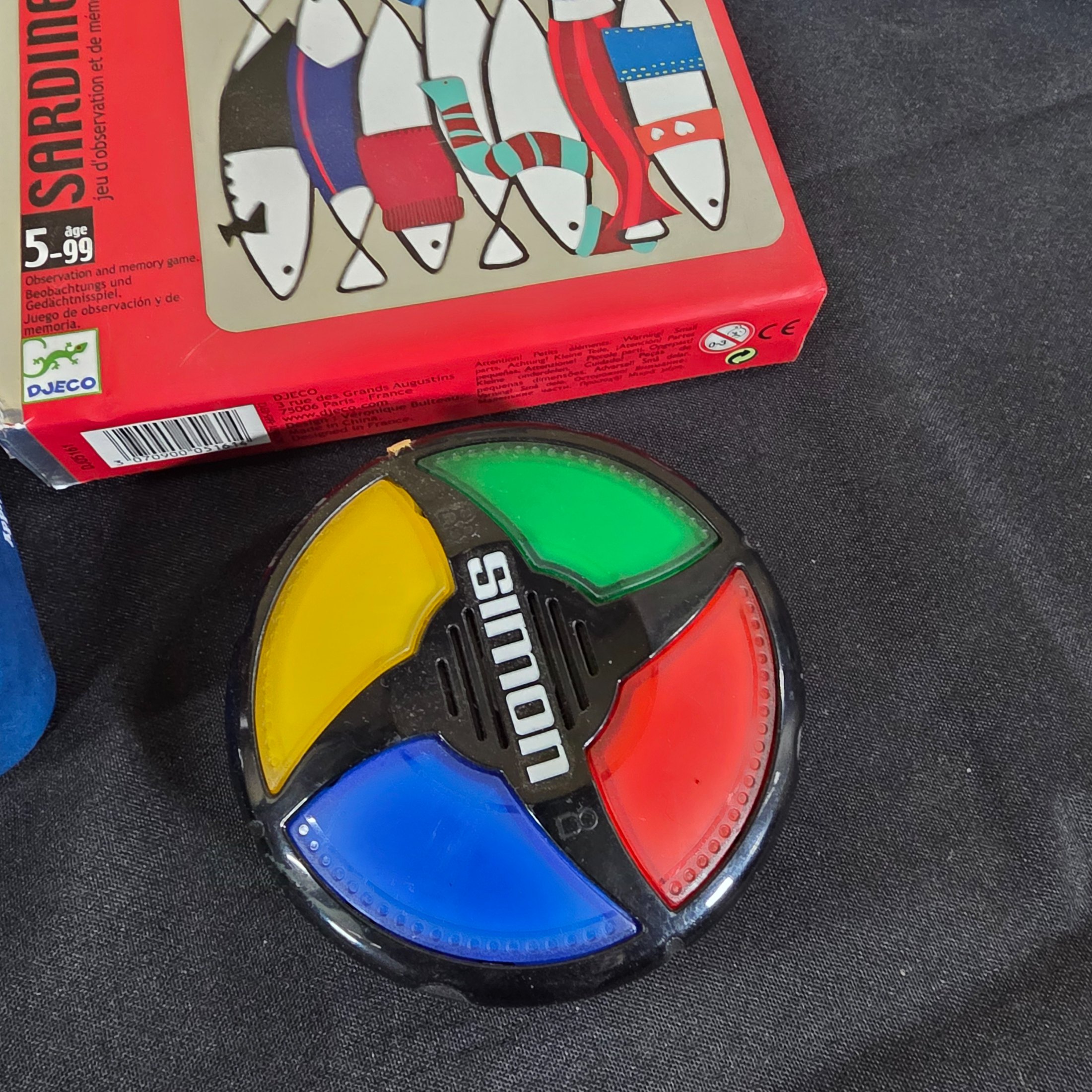 A diverse collection of modern and vintage board games, card games, and puzzles, including Monopoly, Jenga Quake, Mousie Mousie, and a Captain Cook's Voyage puzzle. - View 8