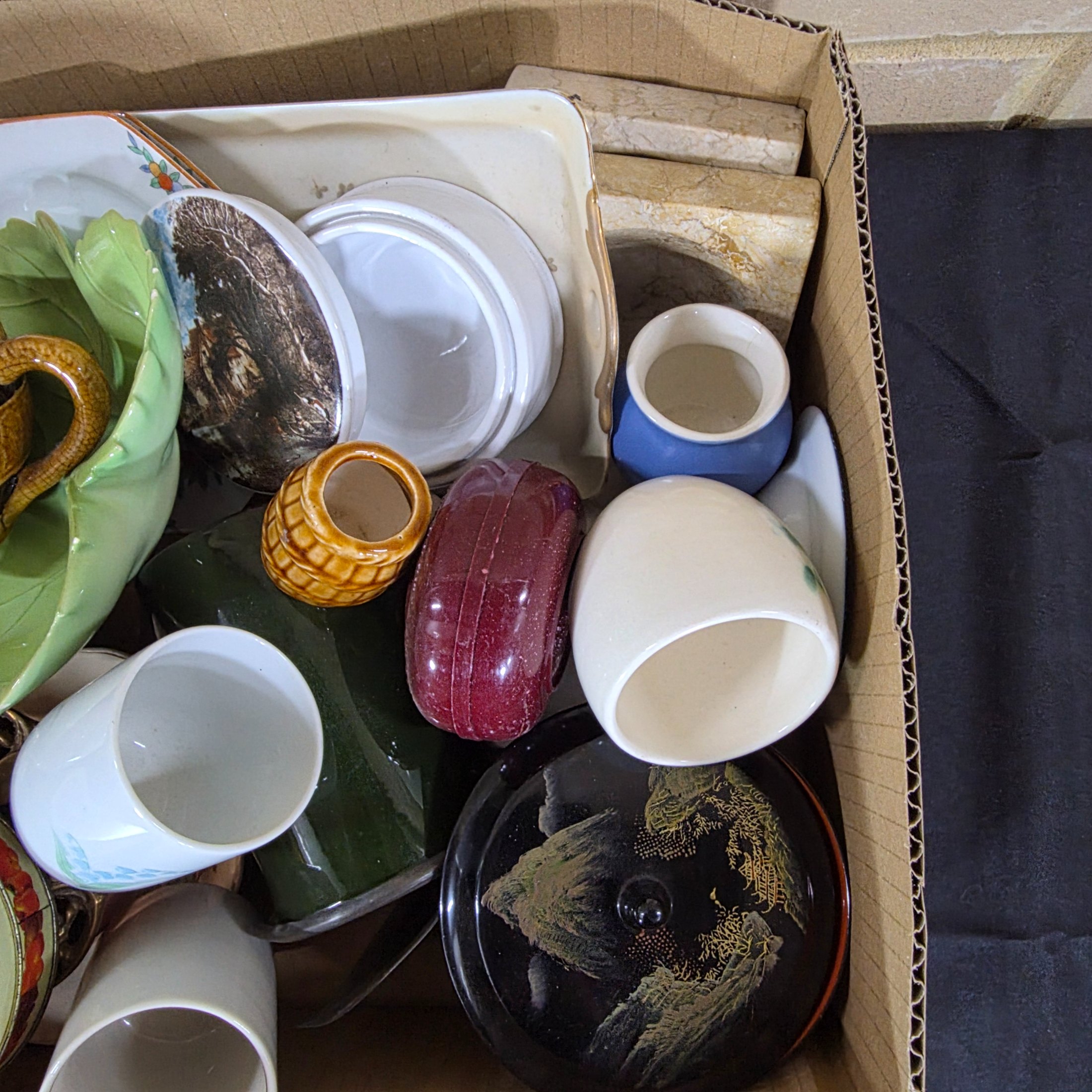 A diverse collection of vintage and antique homewares and decorative items, encompassing ceramics, metalware, glass, and wooden objects, presented as a mixed lot. - View 2