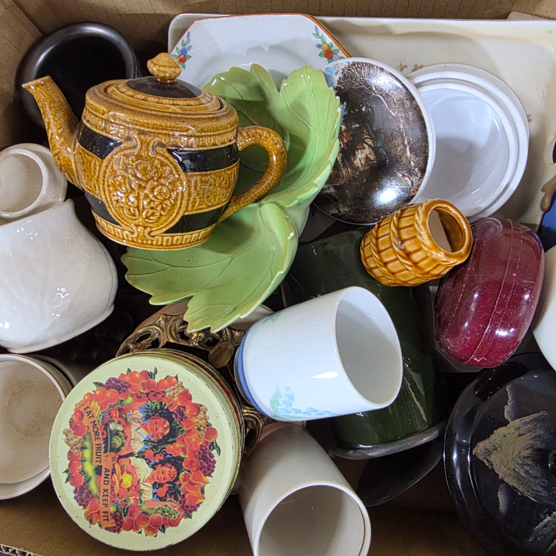 A diverse collection of vintage and antique homewares and decorative items, encompassing ceramics, metalware, glass, and wooden objects, presented as a mixed lot. - View 3