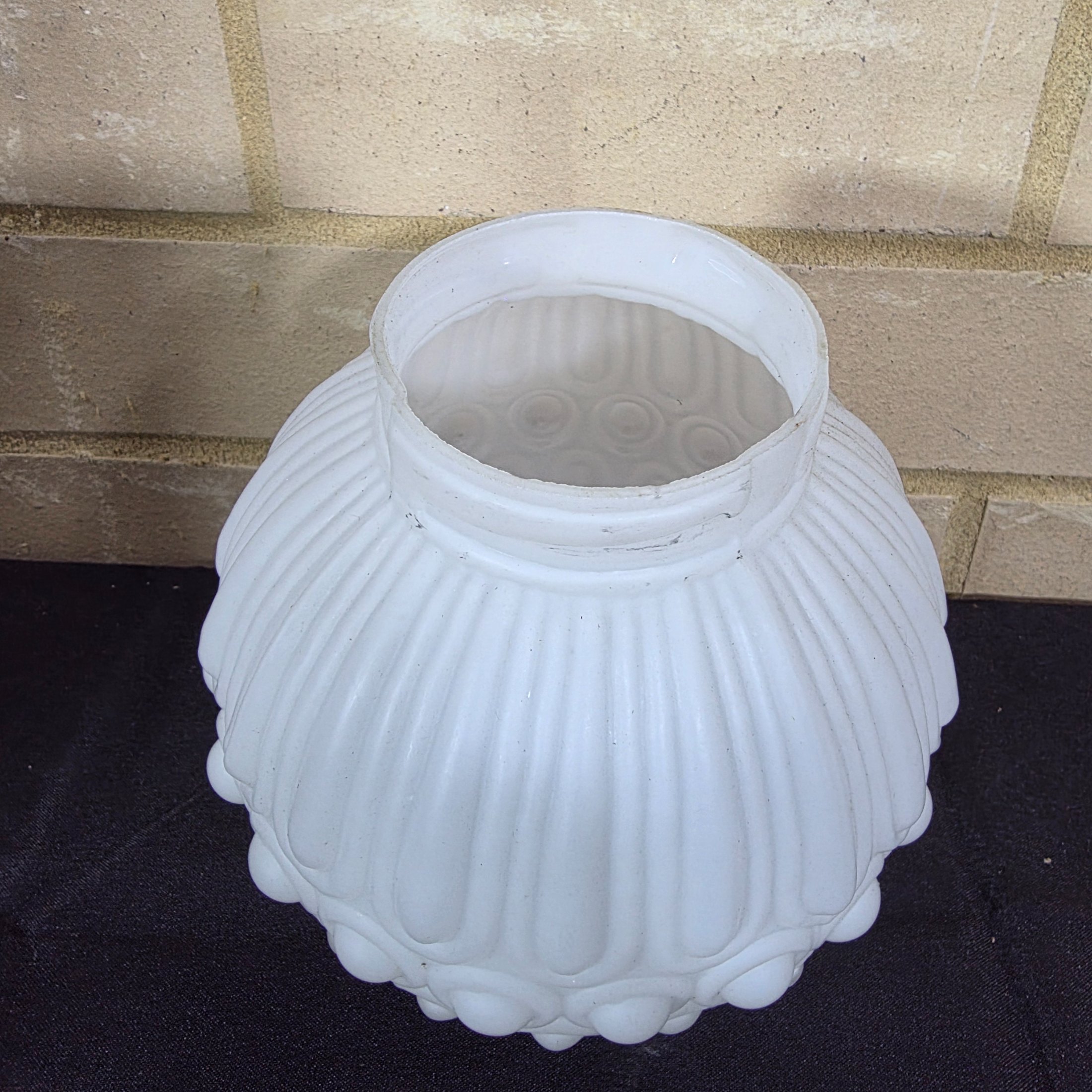 A pair of elegant mid-20th century frosted glass light shades, featuring a distinctive ribbed and raised circular motif, suitable for decorative lighting. - View 5