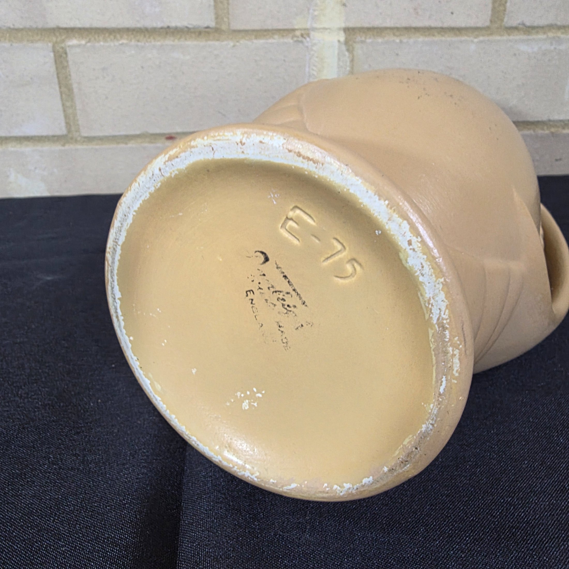 A vintage English ceramic pitcher jug, likely mid-20th century, crafted in a light tan/beige glaze with a distinctive ribbed body design. - View 5