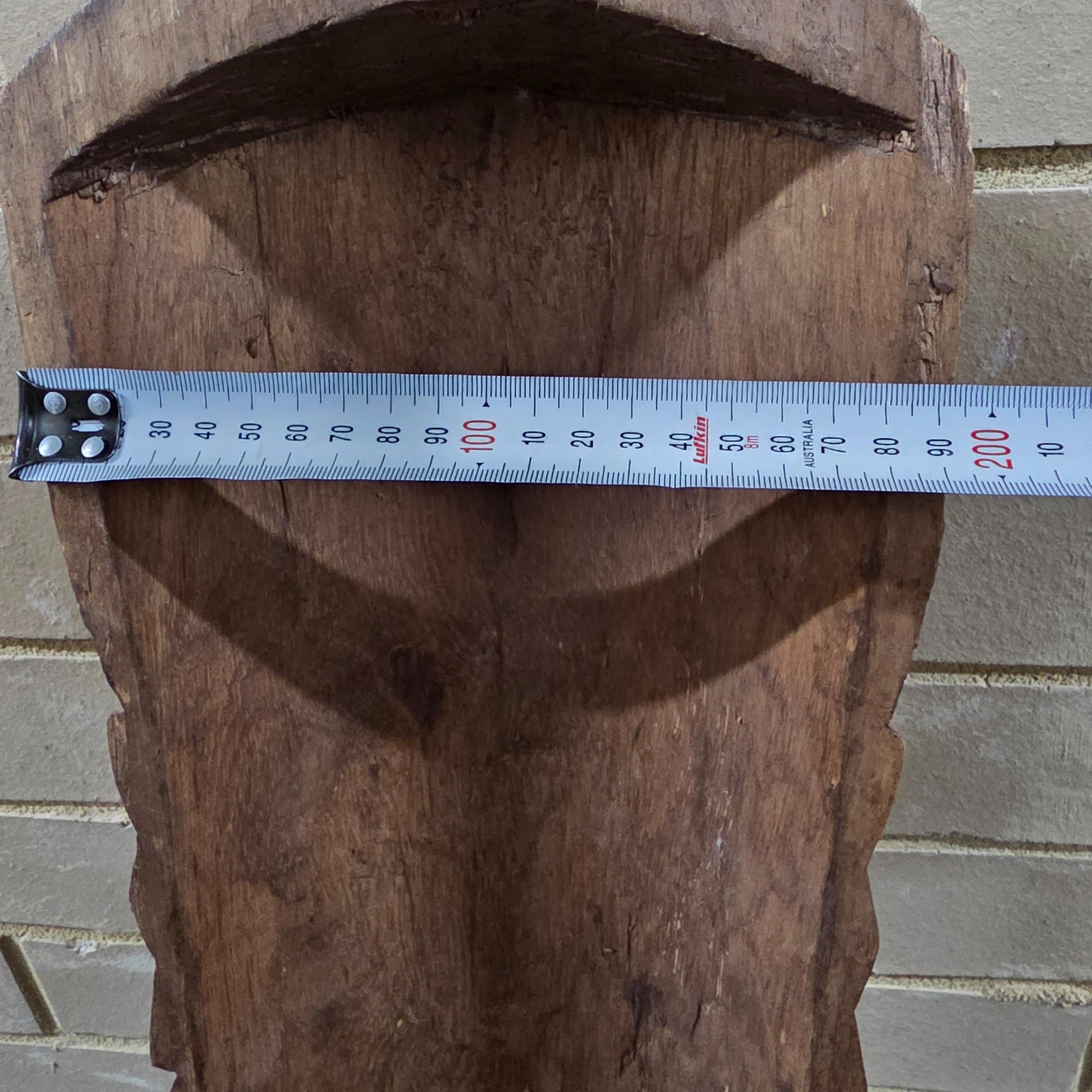 A striking vintage hand-carved wooden mask, featuring intricate tribal-style detailing and a rich dark wood finish, likely from the mid-20th century. - View 3