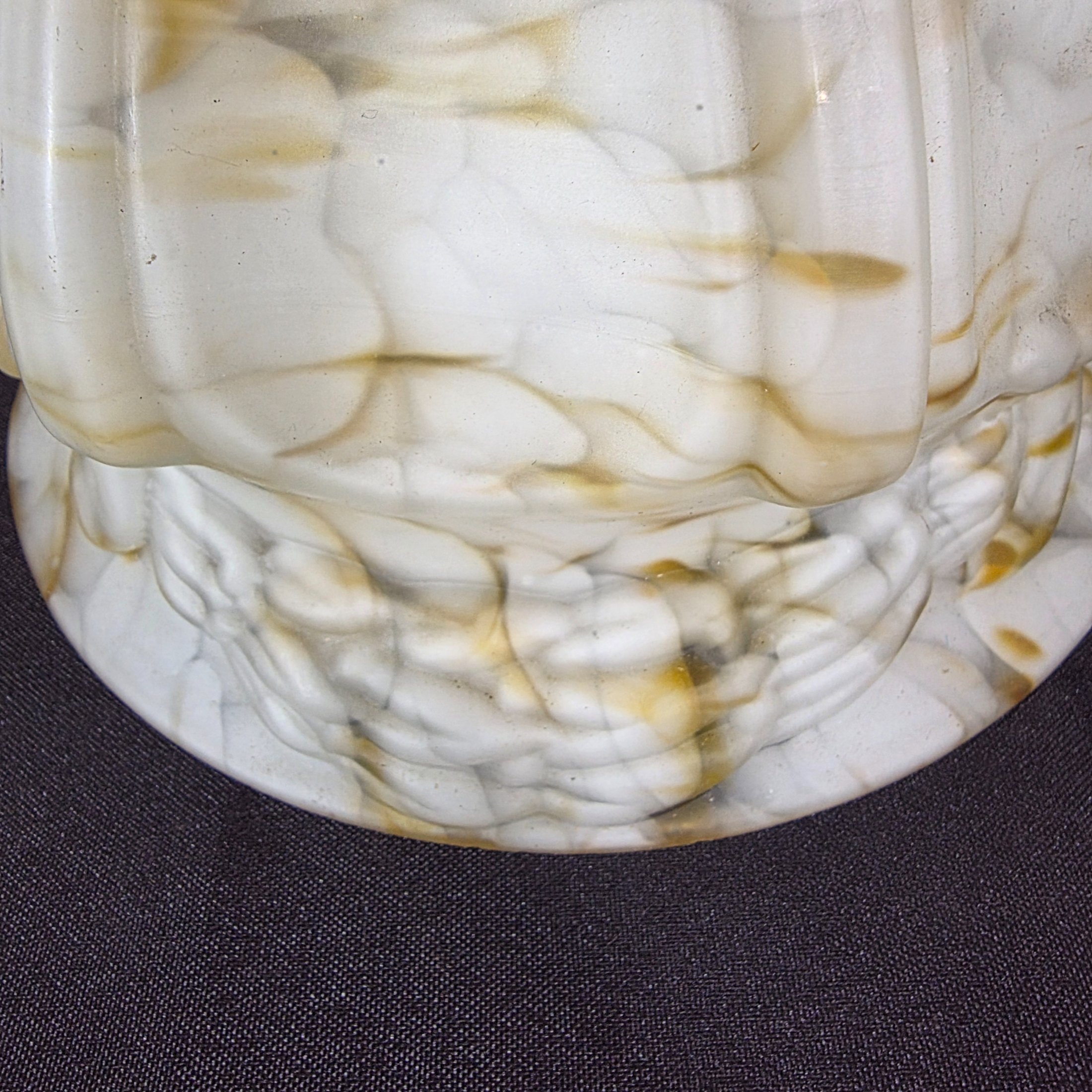 A vintage decorative glass light shade, featuring a marbled white and amber slag glass pattern with a fluted, ruffled design, circa mid-20th century. - View 6