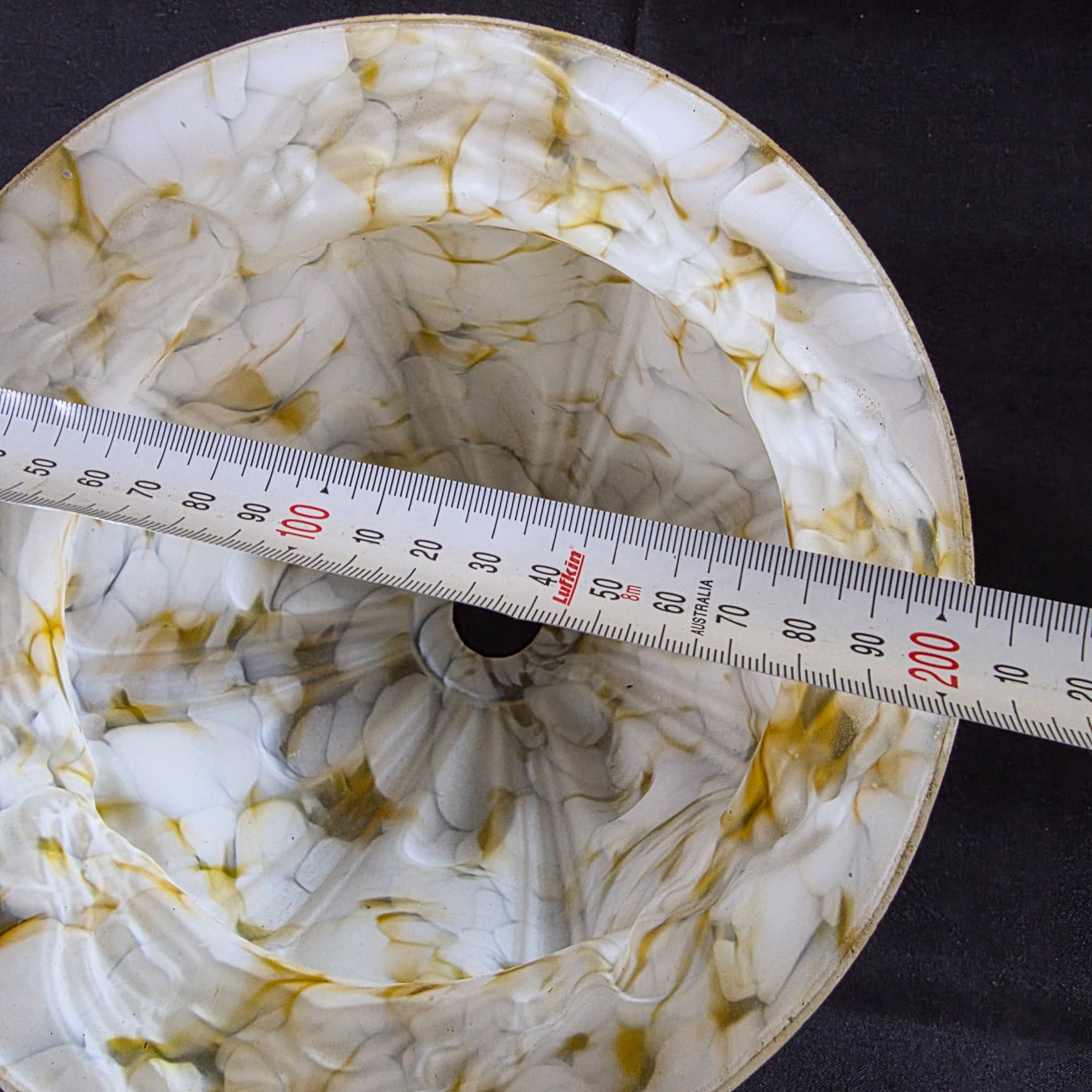 A vintage decorative glass light shade, featuring a marbled white and amber slag glass pattern with a fluted, ruffled design, circa mid-20th century. - View 8