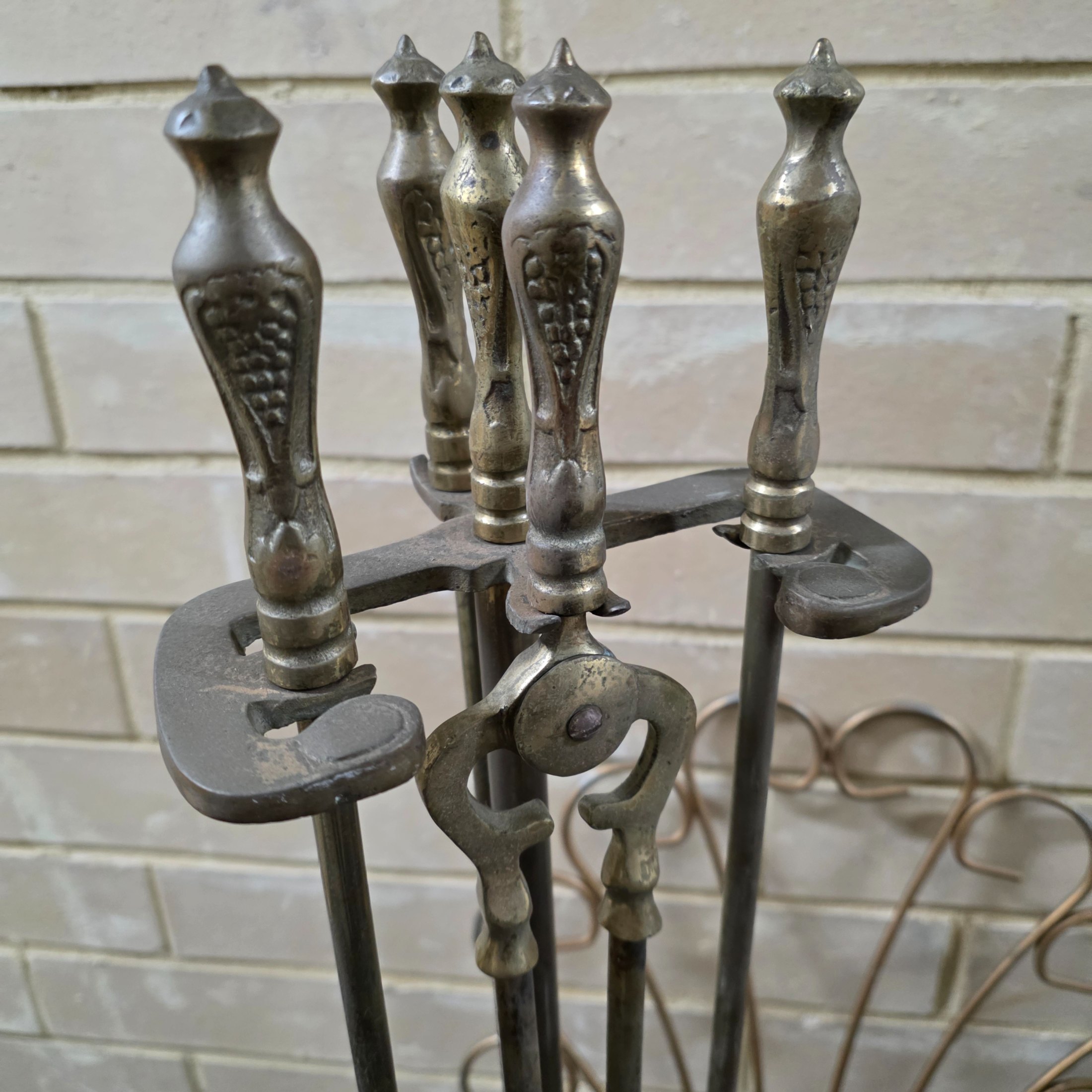 A comprehensive lot of vintage homewares and fireplace accessories, showcasing a blend of metallic craftsmanship and rustic charm, dating from the mid-20th century. - View 2