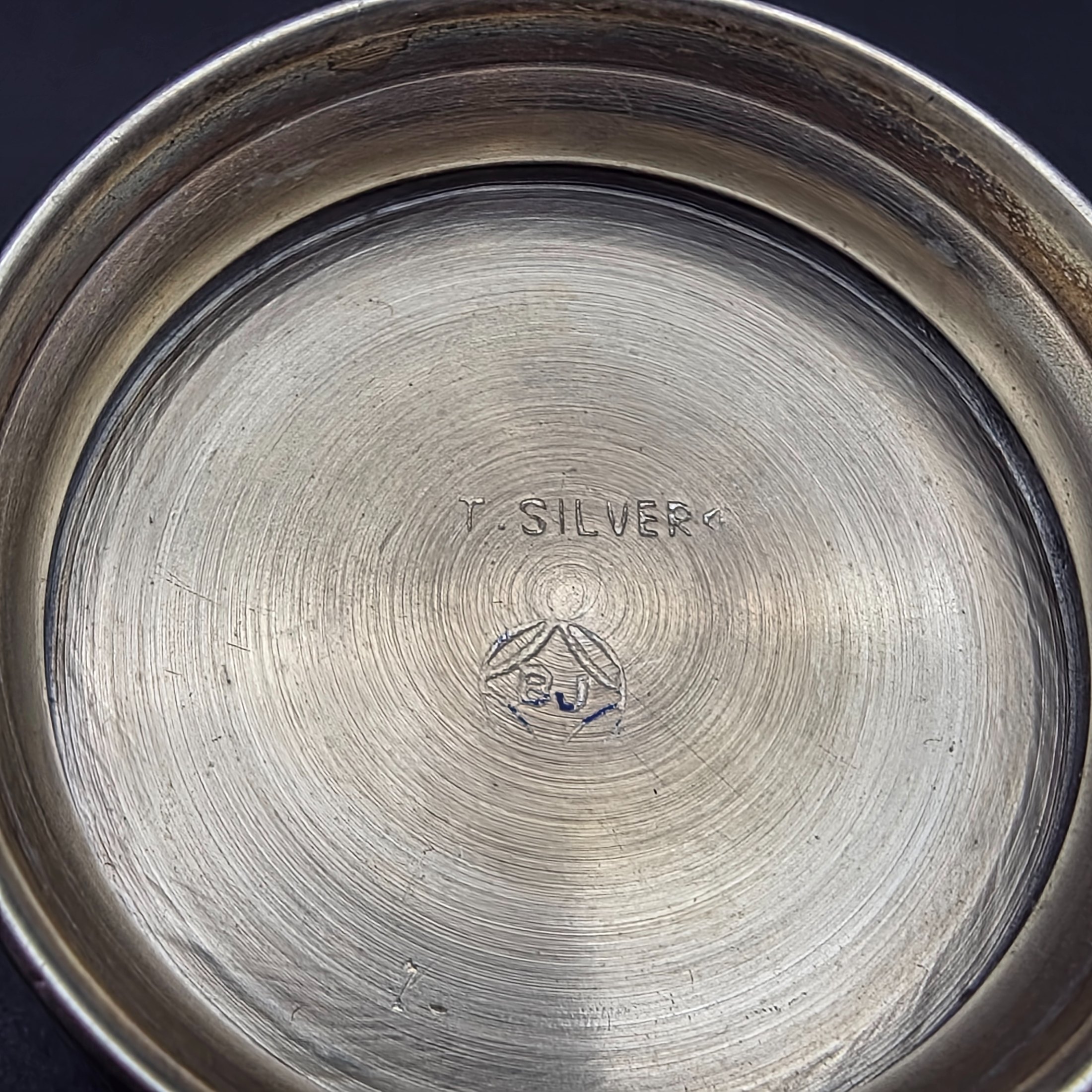 A collection of four vintage silver-toned items, including a sterling silver napkin ring, a second napkin ring, a ribbed cup, and a lidded box, dating from the early to mid-20th century. - View 7