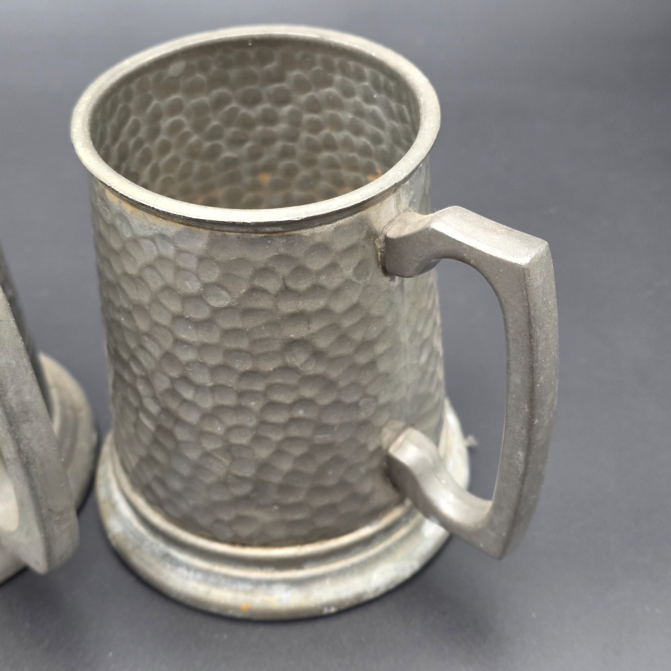 A collection featuring three vintage pewter tankards and two small pewter knight figurines, showcasing different manufacturing origins and finishes from the mid to late 20th century. - View 5