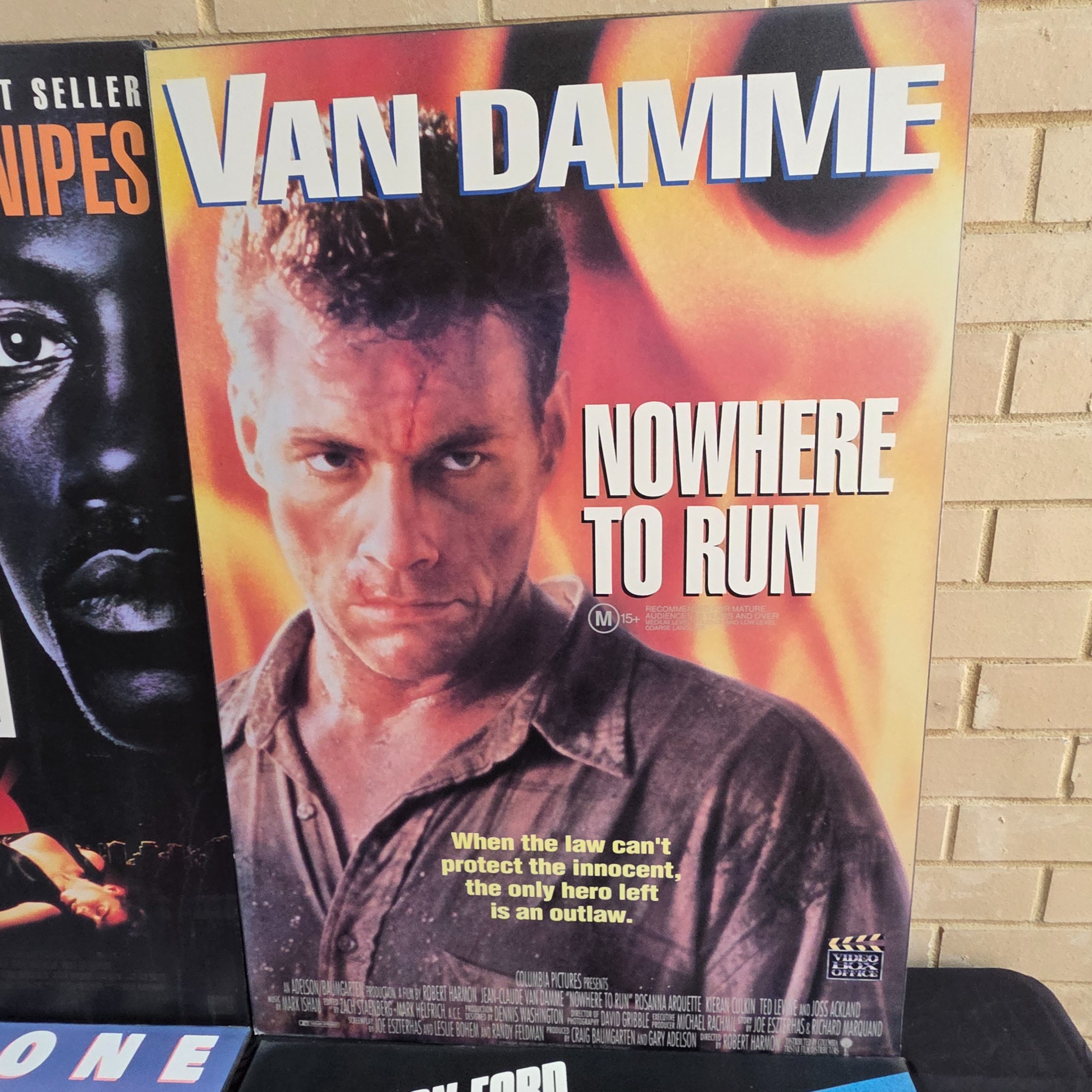 Four mounted original movie posters from the early 1990s, featuring classic action films 'Rising Sun', 'Nowhere to Run', 'Cliffhanger', and 'The Fugitive'. - View 3