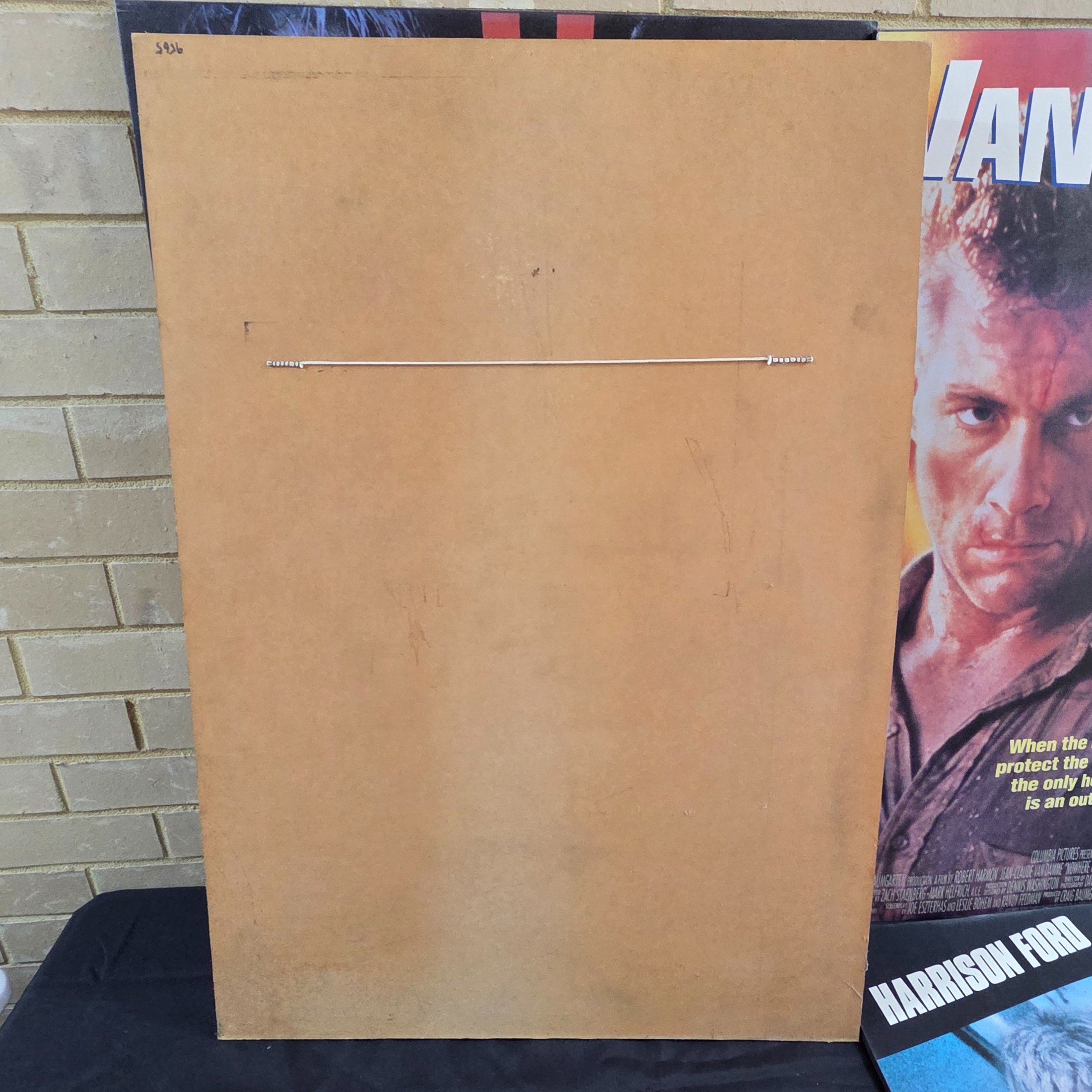 Four mounted original movie posters from the early 1990s, featuring classic action films 'Rising Sun', 'Nowhere to Run', 'Cliffhanger', and 'The Fugitive'. - View 6