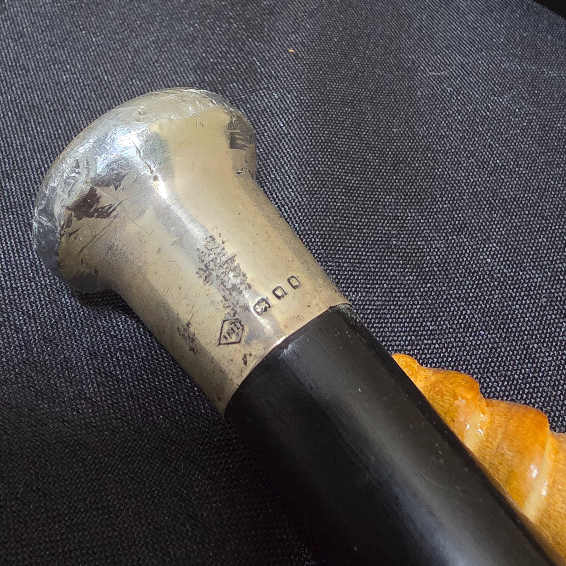 A collection of two vintage walking sticks and a white Sunbella umbrella, including one walking stick with a hallmarked sterling silver cap. - View 2