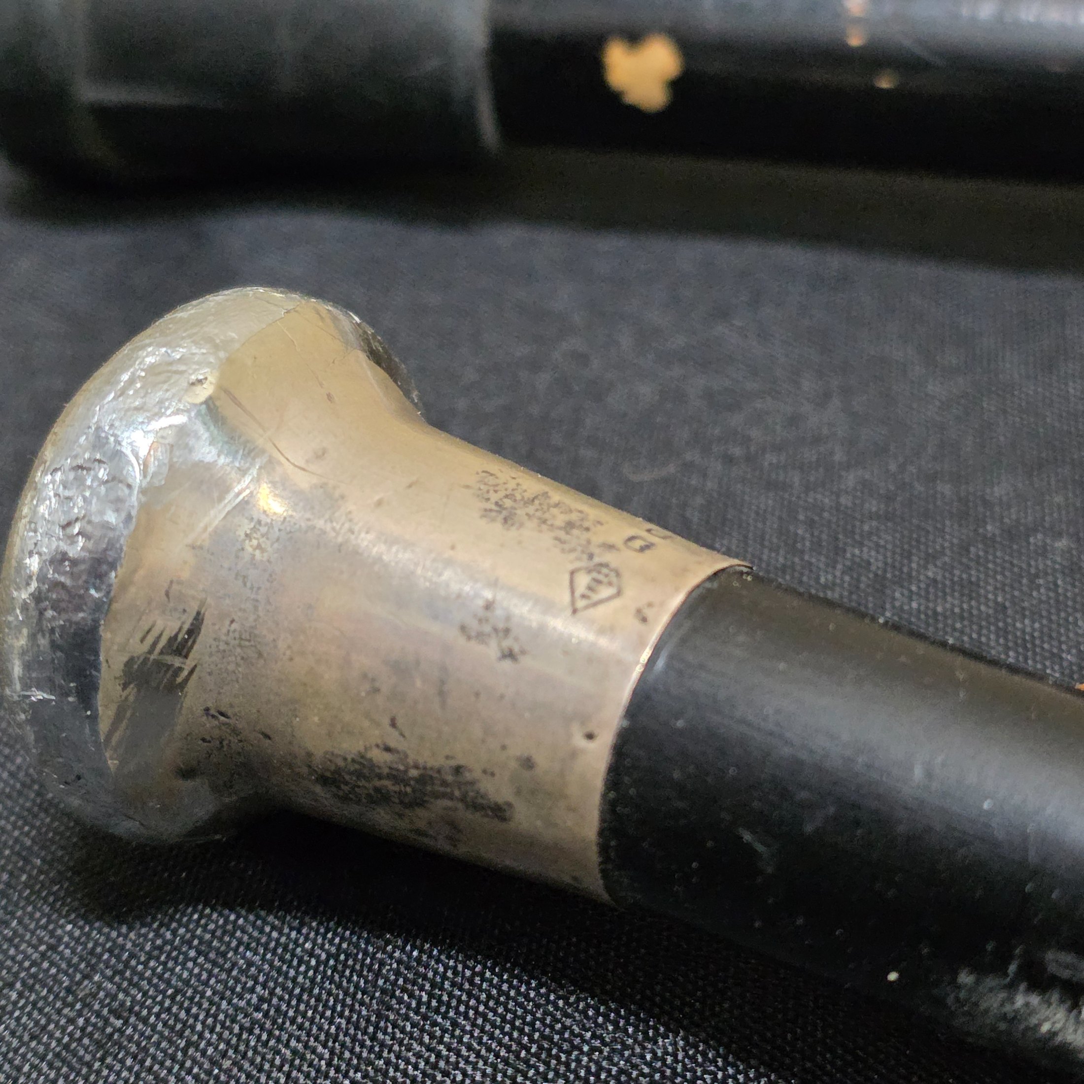 A collection of two vintage walking sticks and a white Sunbella umbrella, including one walking stick with a hallmarked sterling silver cap. - View 3