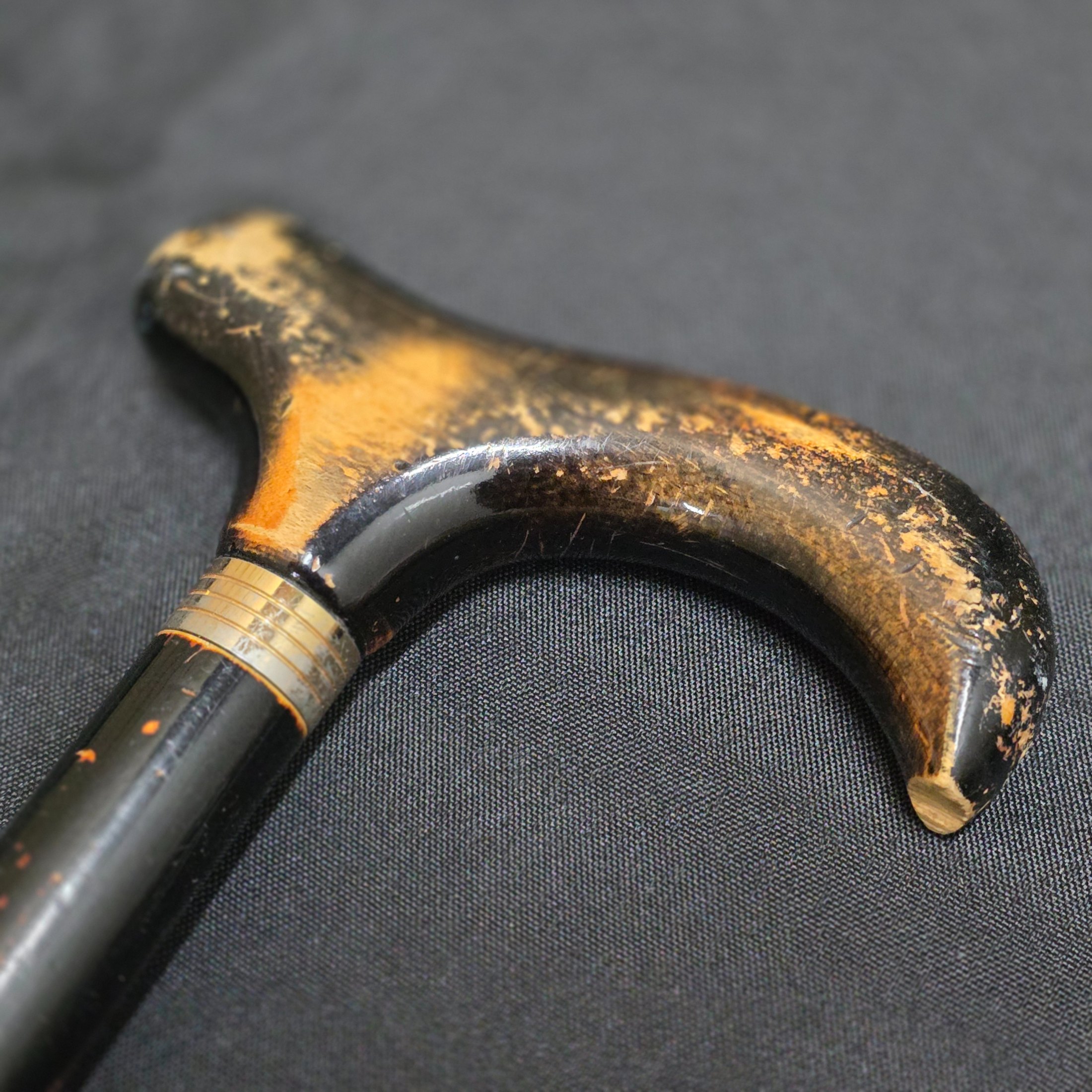 A collection of two vintage walking sticks and a white Sunbella umbrella, including one walking stick with a hallmarked sterling silver cap. - View 7