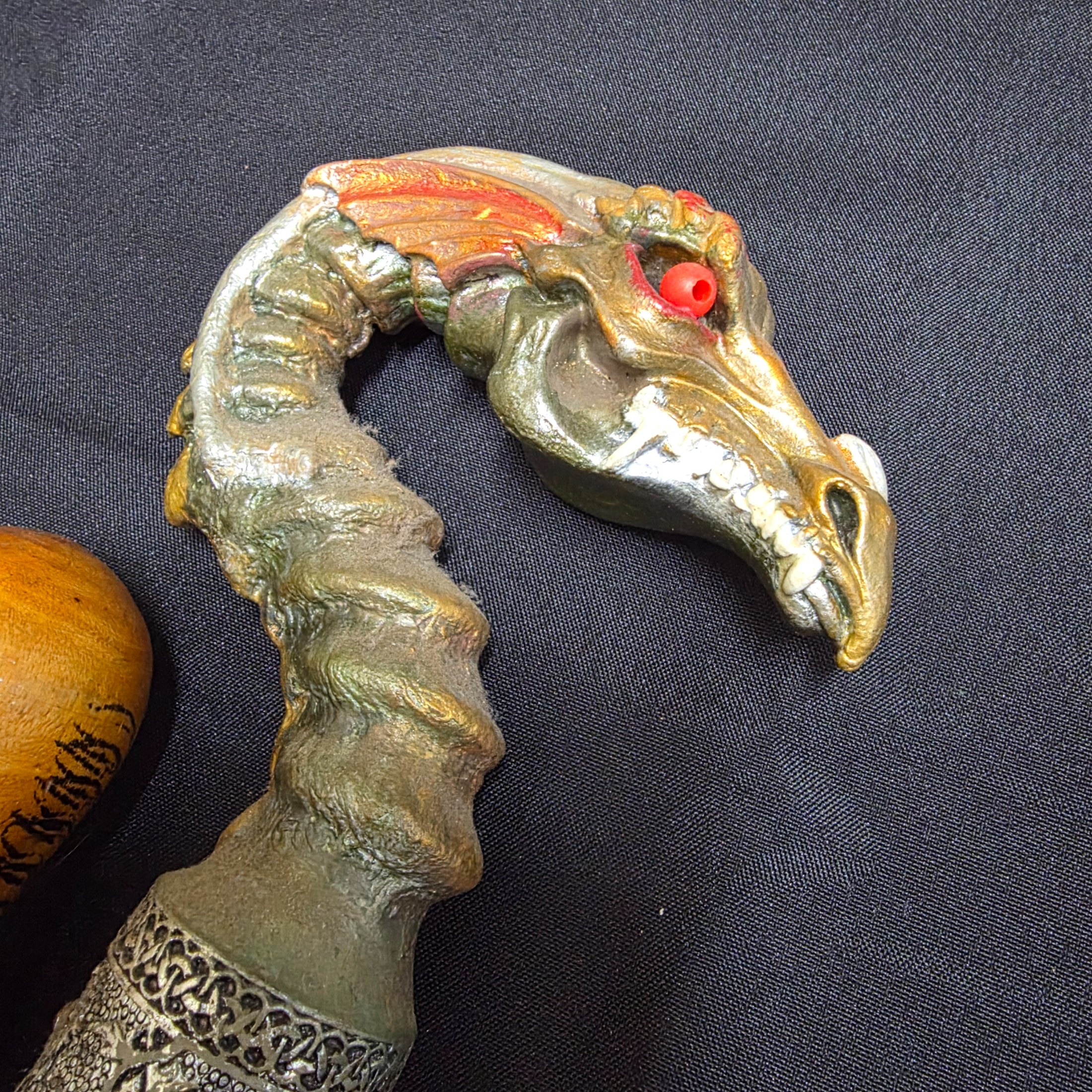 A collection of three vintage decorative walking sticks, featuring a carved wooden handle, a dragon-head handle, and a clear resin handle with an embedded scorpion. - View 7