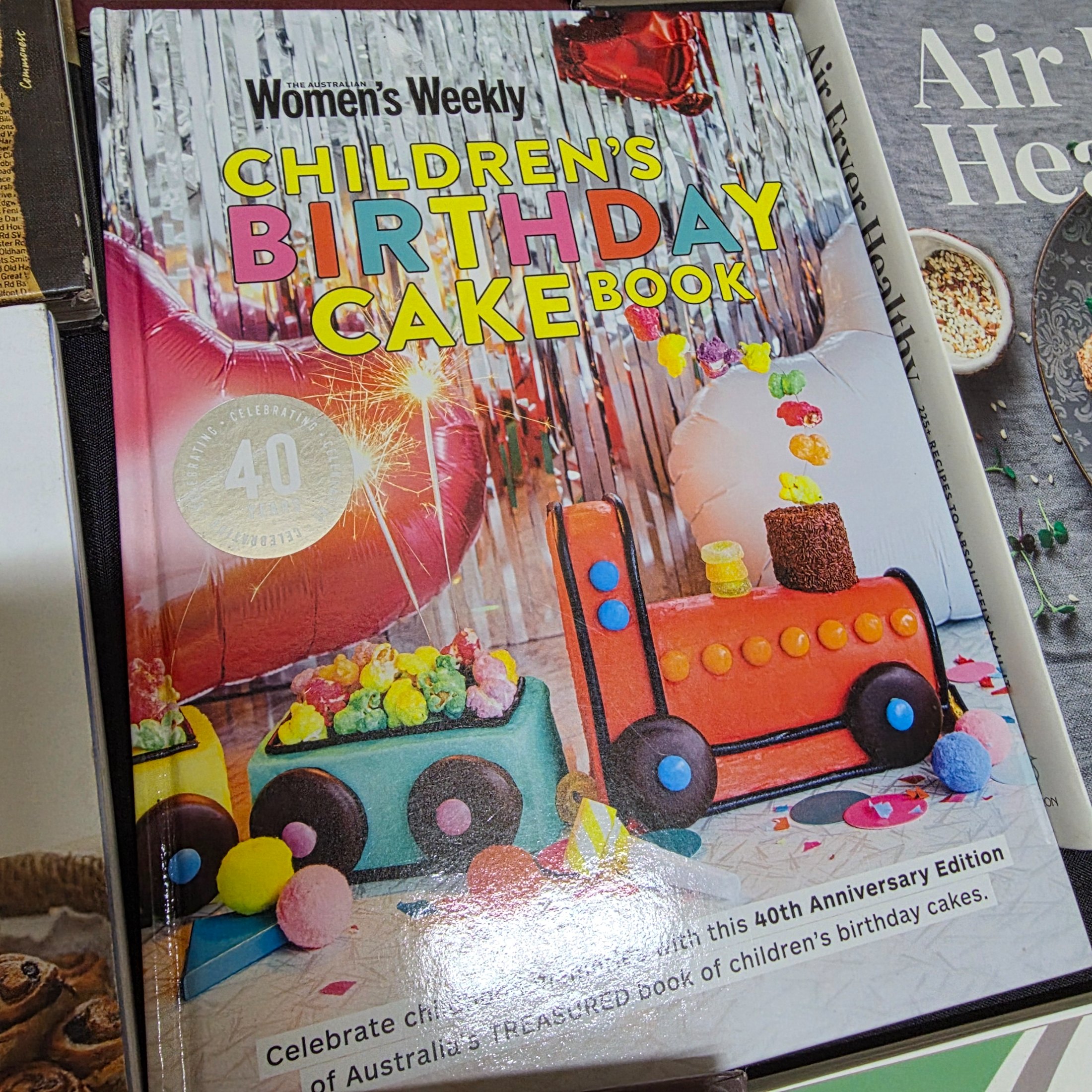 A diverse collection of thirteen pre-owned books, encompassing a range of genres from Australian history and finance to popular cookbooks and reference materials. - View 2