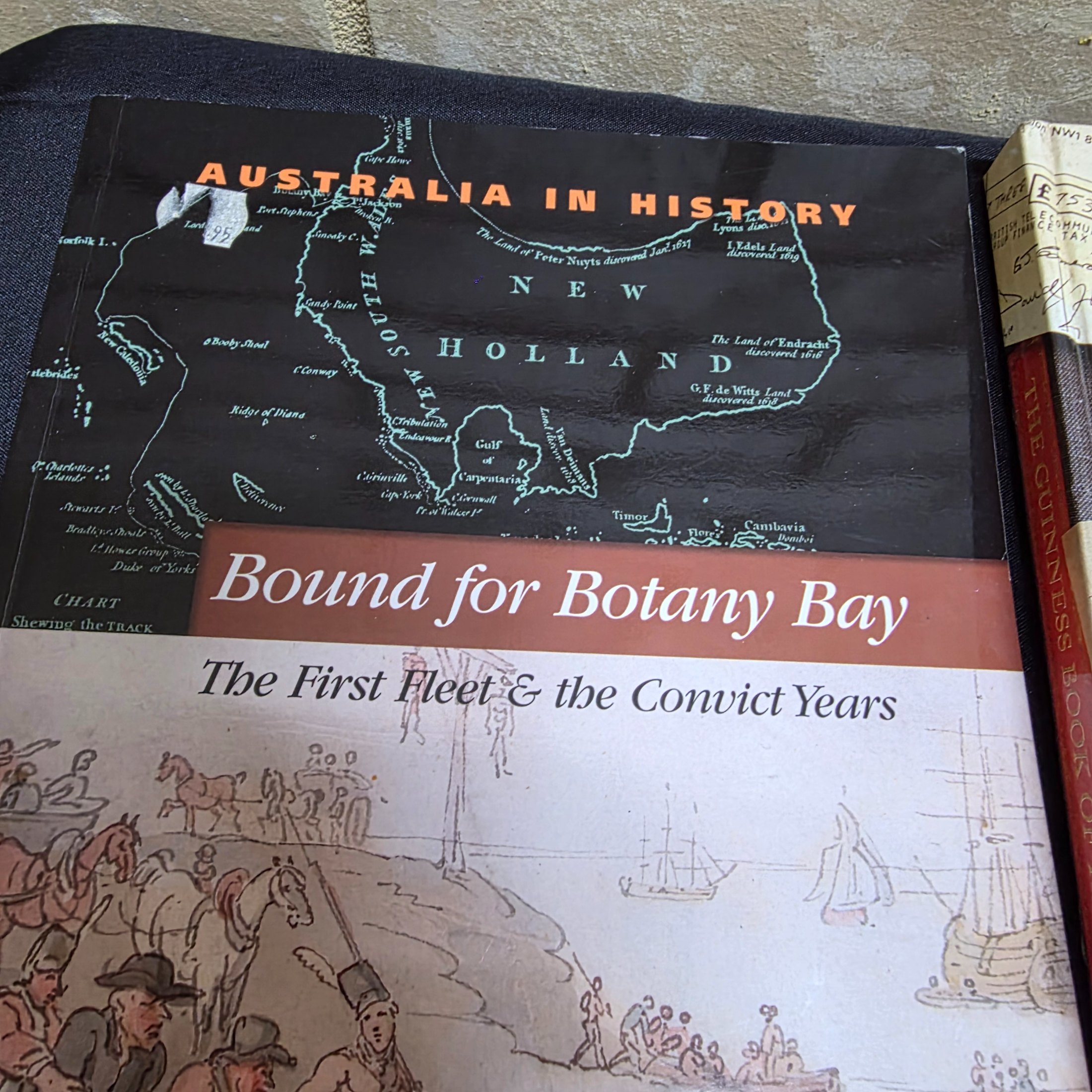 A diverse collection of thirteen pre-owned books, encompassing a range of genres from Australian history and finance to popular cookbooks and reference materials. - View 6