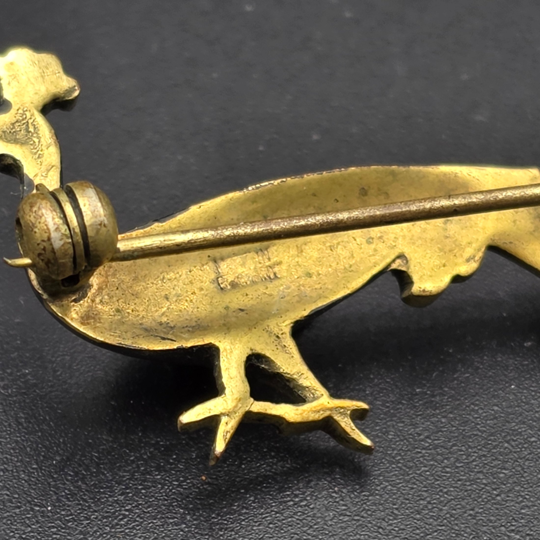 A collection of vintage personal accessories including a bee stick pin, a peacock brooch, a ceramic rose hat pin, and a cased magnifying glass in a red box. - View 6