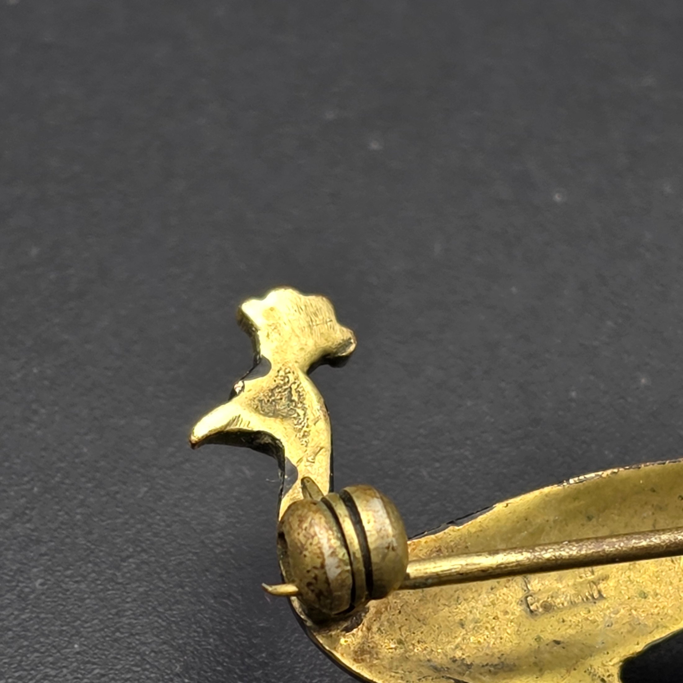 A collection of vintage personal accessories including a bee stick pin, a peacock brooch, a ceramic rose hat pin, and a cased magnifying glass in a red box. - View 7
