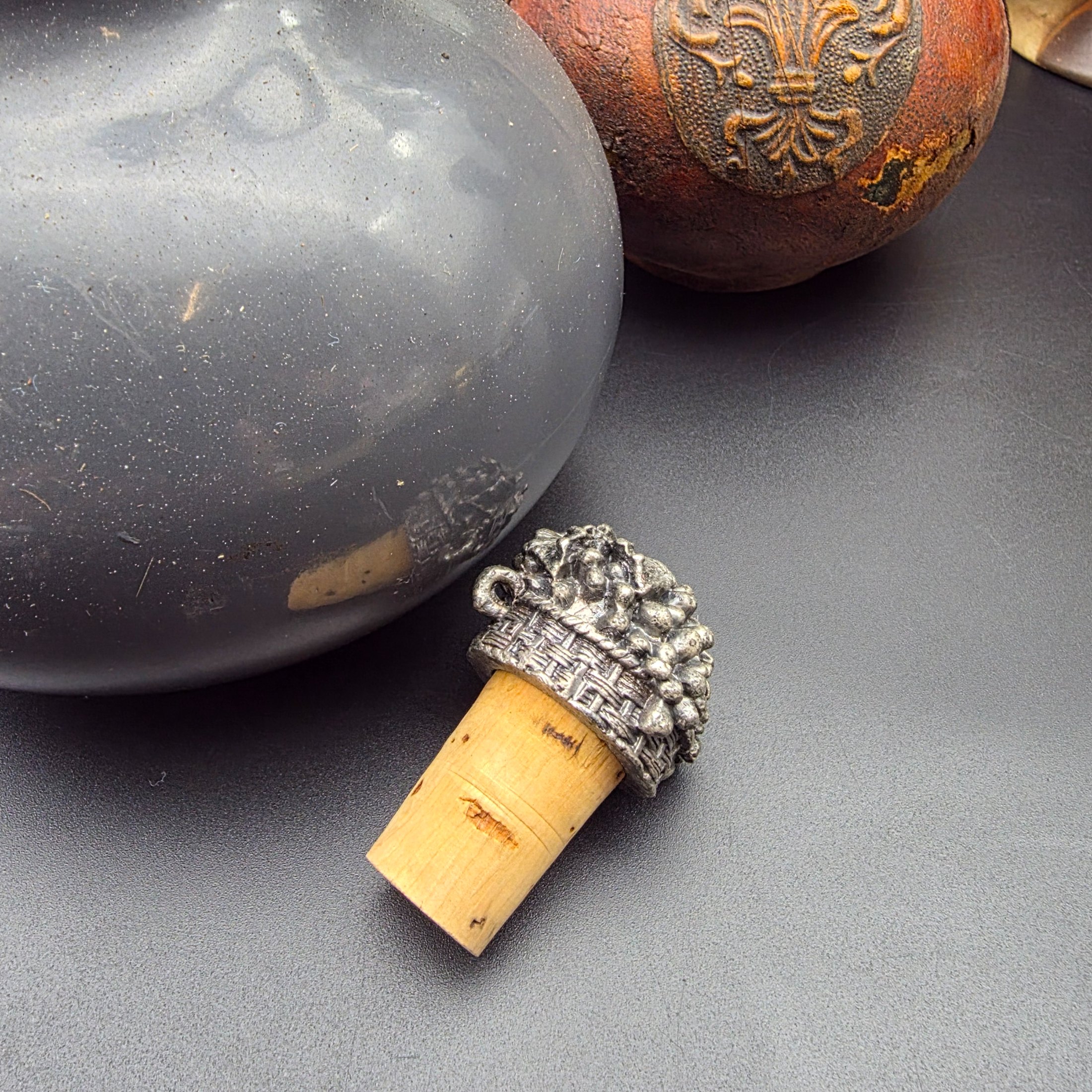 A mixed lot of vintage decorative items including wicker and leather-wrapped glass bottles, ceramic vases from Hamilton England, and an empty Otard XO Cognac bottle. - View 3