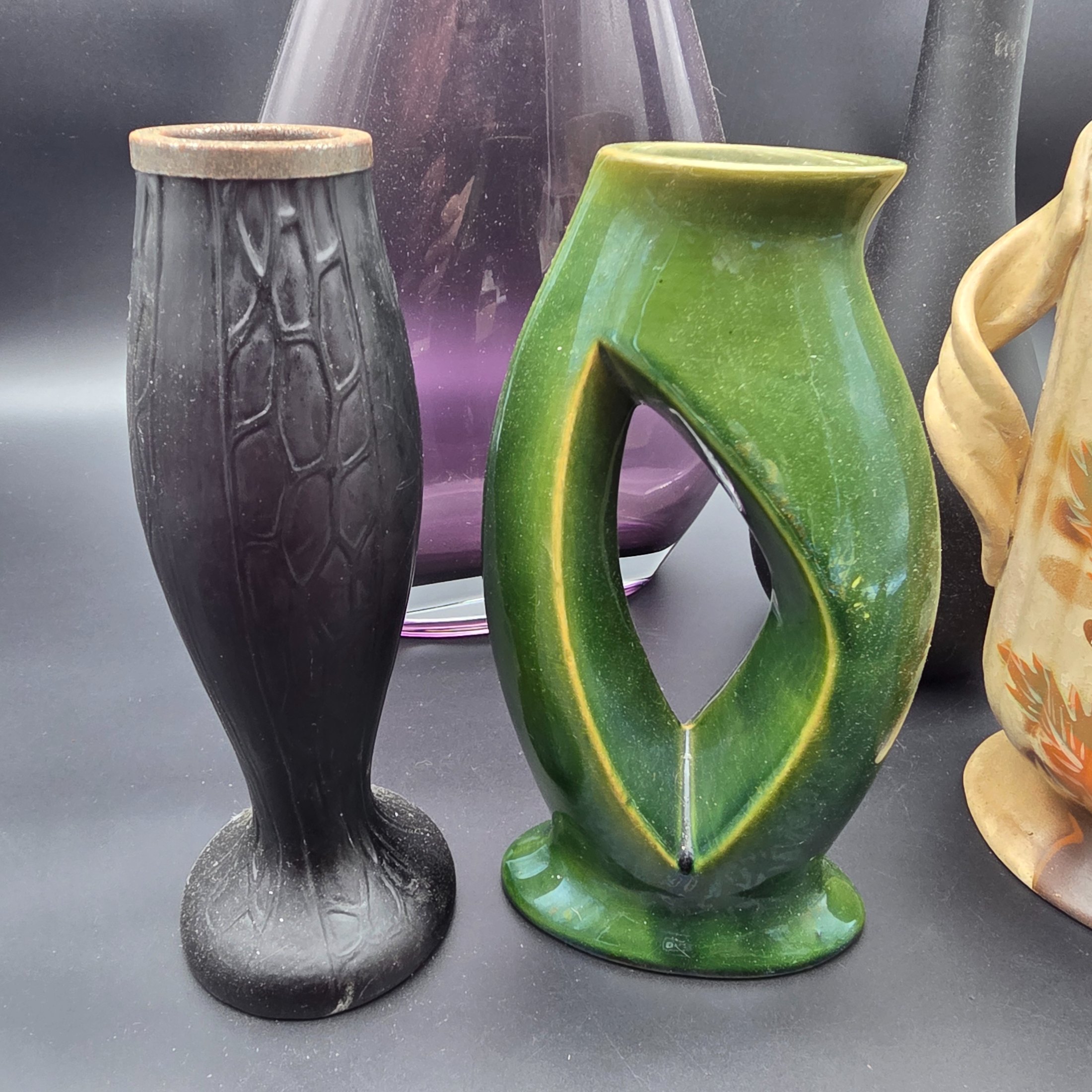 A mixed lot of vintage decorative items including wicker and leather-wrapped glass bottles, ceramic vases from Hamilton England, and an empty Otard XO Cognac bottle. - View 8