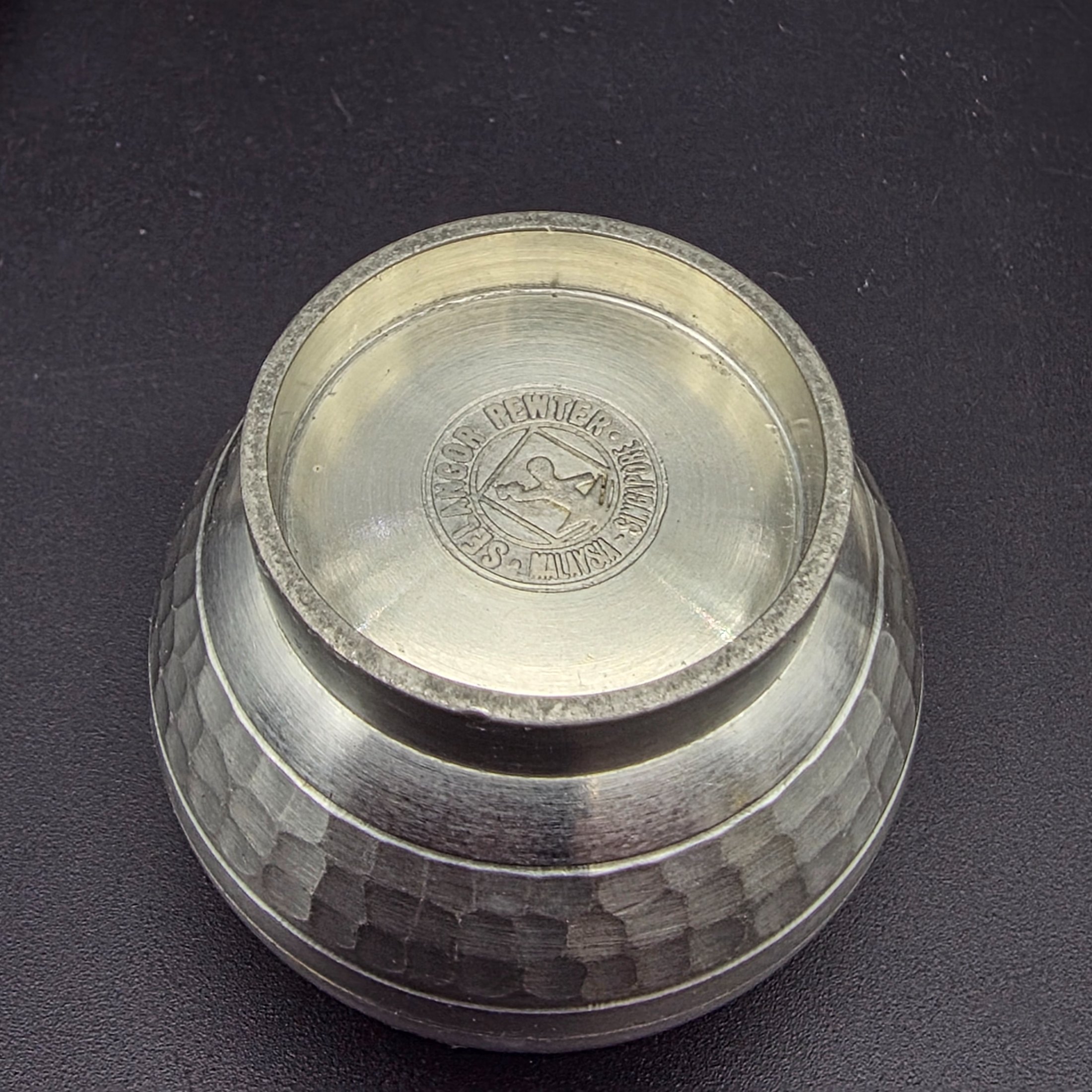 A collection of vintage pewter items including decorative mugs, cups, and small vases, displaying various finishes and makers' marks. - View 8