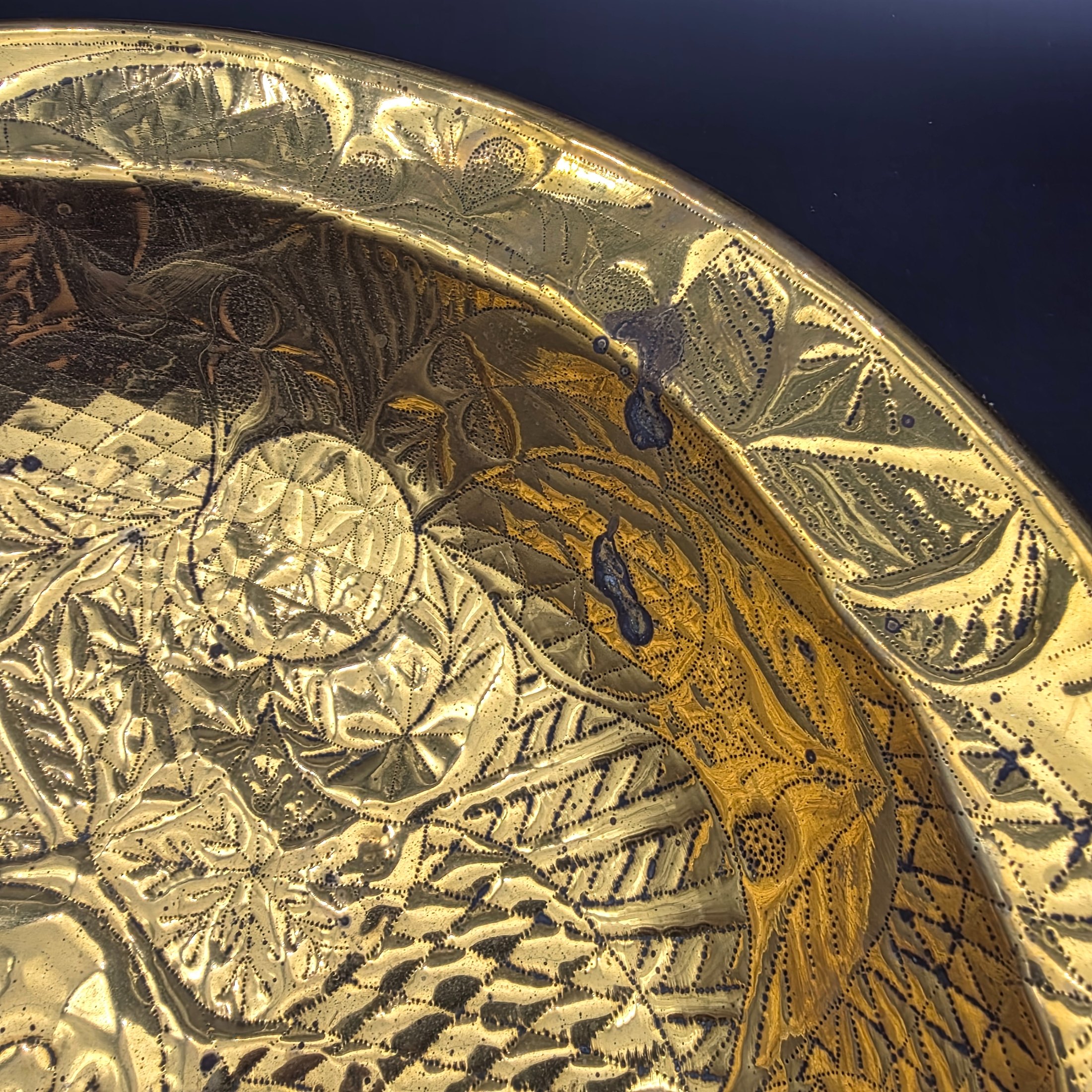 A substantial Victorian decorative basin, meticulously crafted from embossed brass and dated 1880. This piece showcases intricate repoussé and chased patterns, characteristic of the era's decorative metalwork, and would have served as an opulent display item or lavabo basin. - View 4