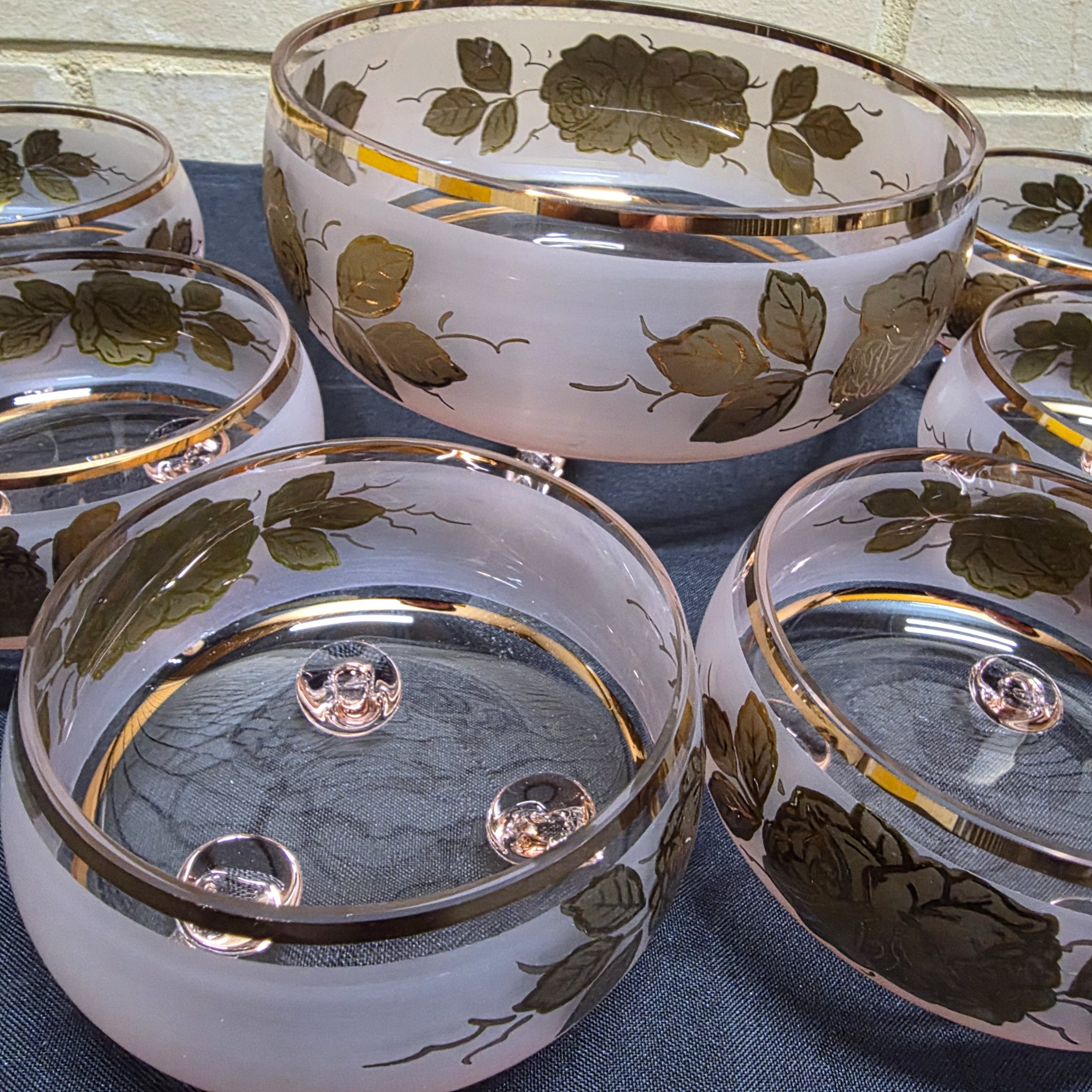 A charming vintage frosted pink and gold glass dessert set, comprising one large serving bowl and six smaller individual bowls, likely dating from the mid-20th century. - View 2