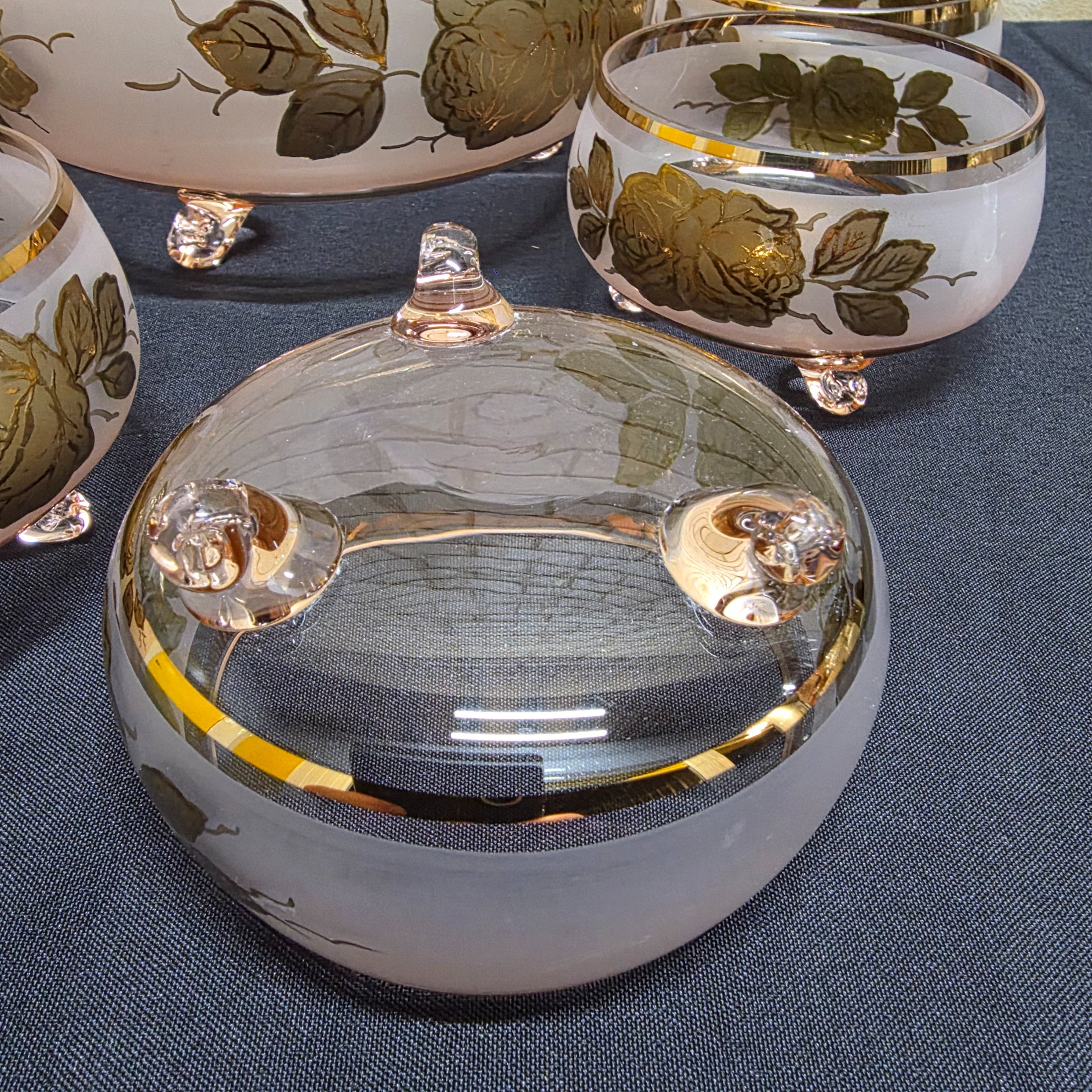 A charming vintage frosted pink and gold glass dessert set, comprising one large serving bowl and six smaller individual bowls, likely dating from the mid-20th century. - View 3