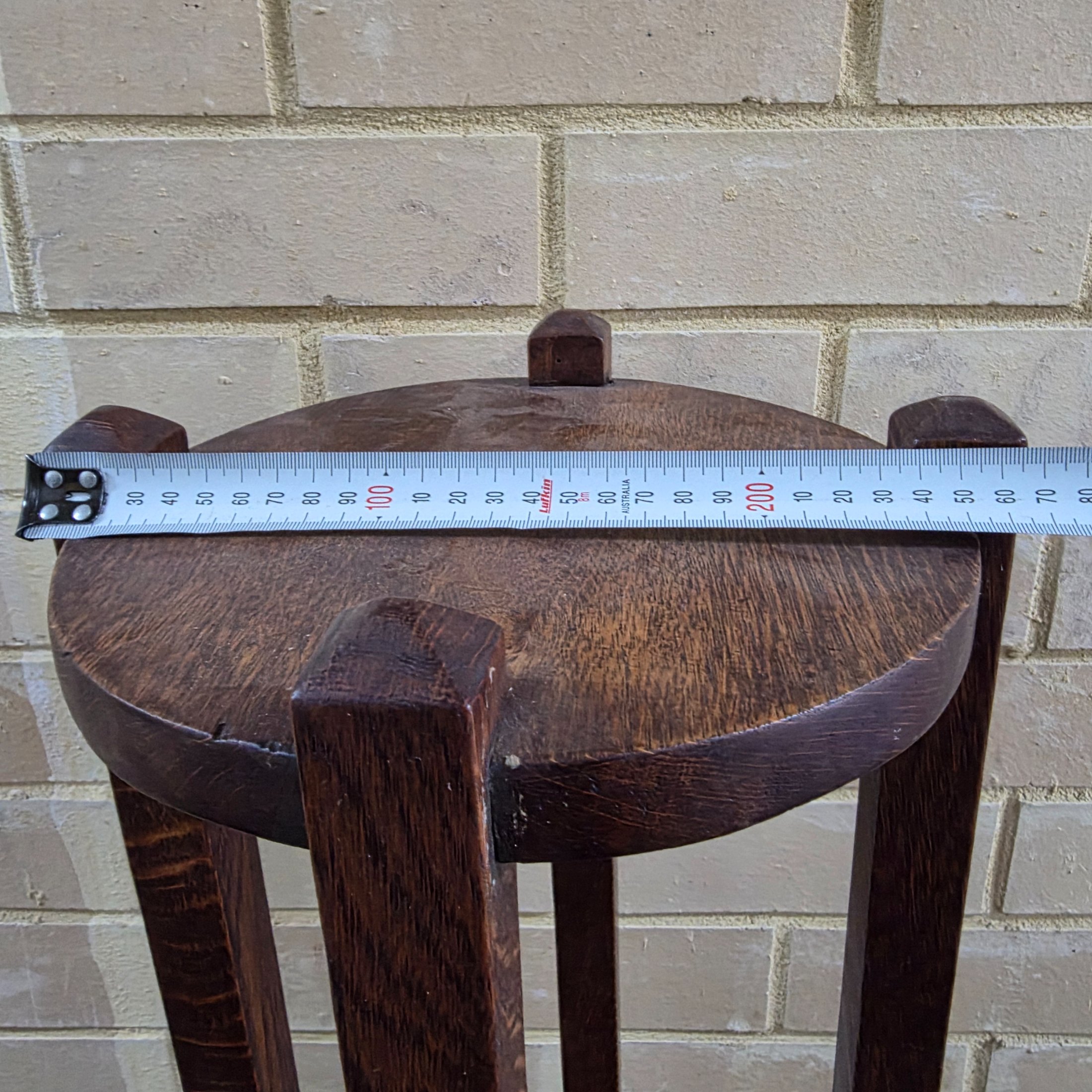 An Arts & Crafts dark oak plant stand or pedestal with a circular top and base, circa early 20th century. - View 4