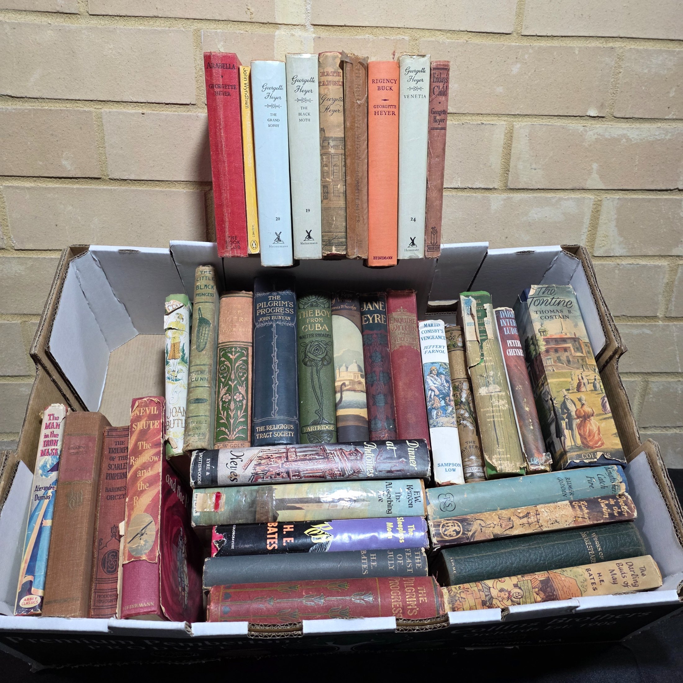 Box of Assorted Hardcover Vintage Books incl. Georgette Heyer, H.E. Bates & Charlotte Bronte — Lot 120, photograph 1